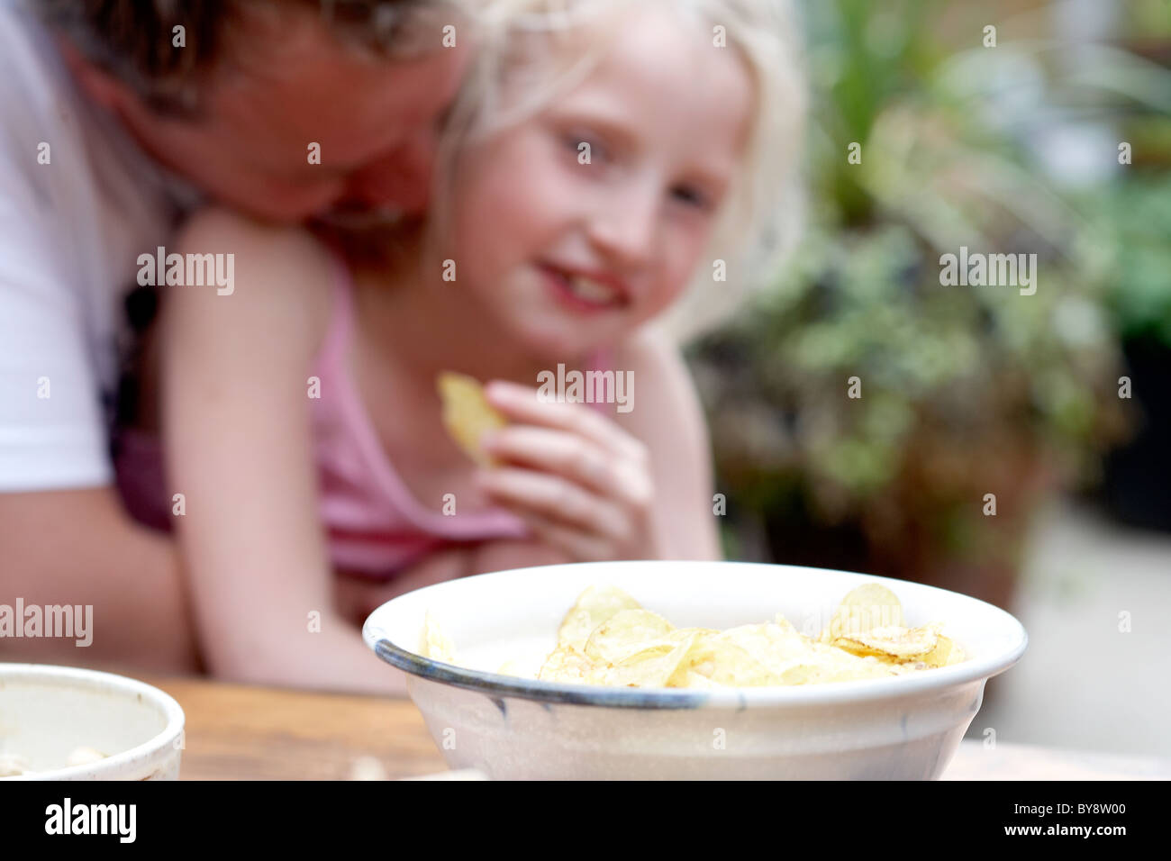 Child eating crisps Stock Photo