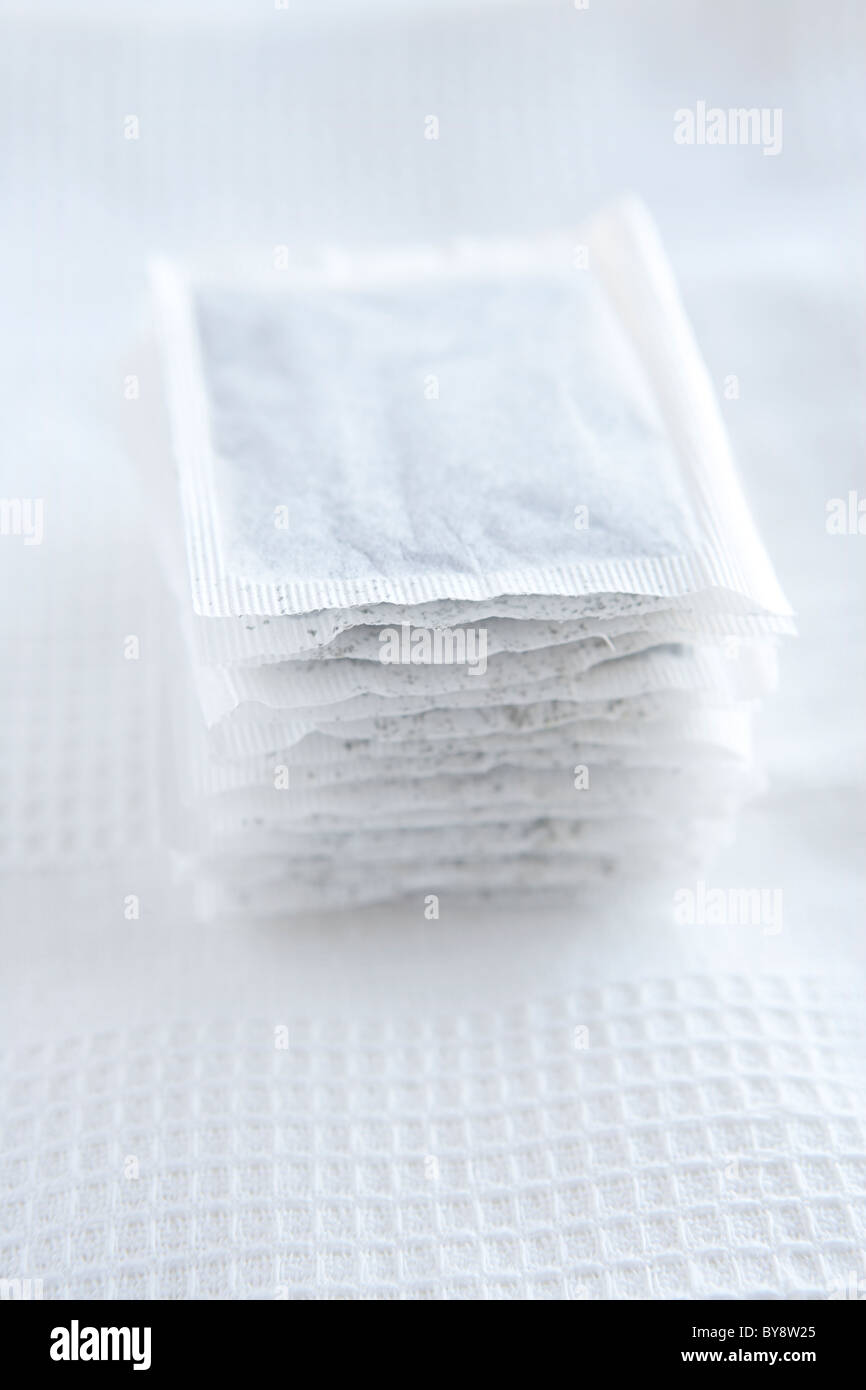 Mint tea bags on white tea towel Stock Photo