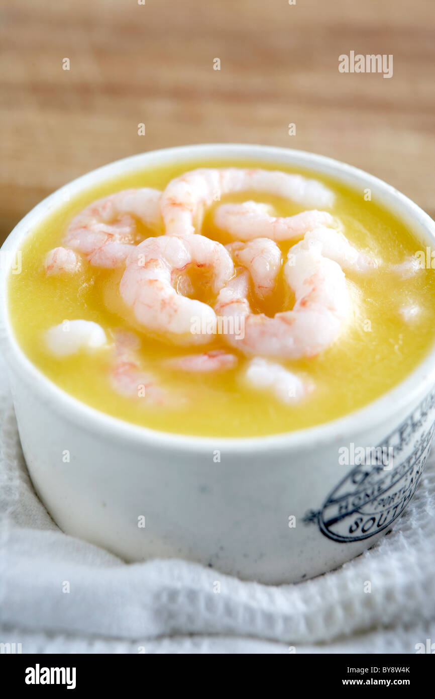 Potted prawns in white container on white folded tea towl Stock Photo