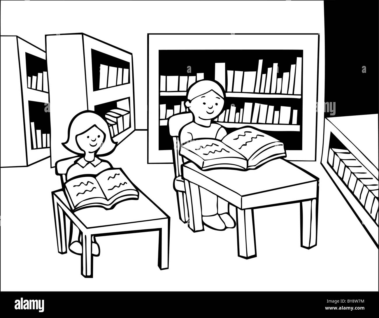 Two children study quietly in a library. Stock Photo
