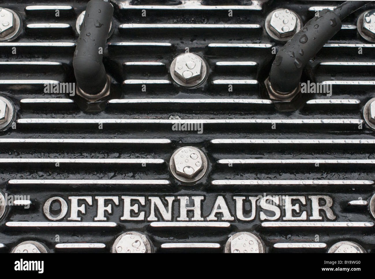 A close up of the top of a 4-cylinder Offenhauser racing engine in a classic American Miller racing car. Stock Photo