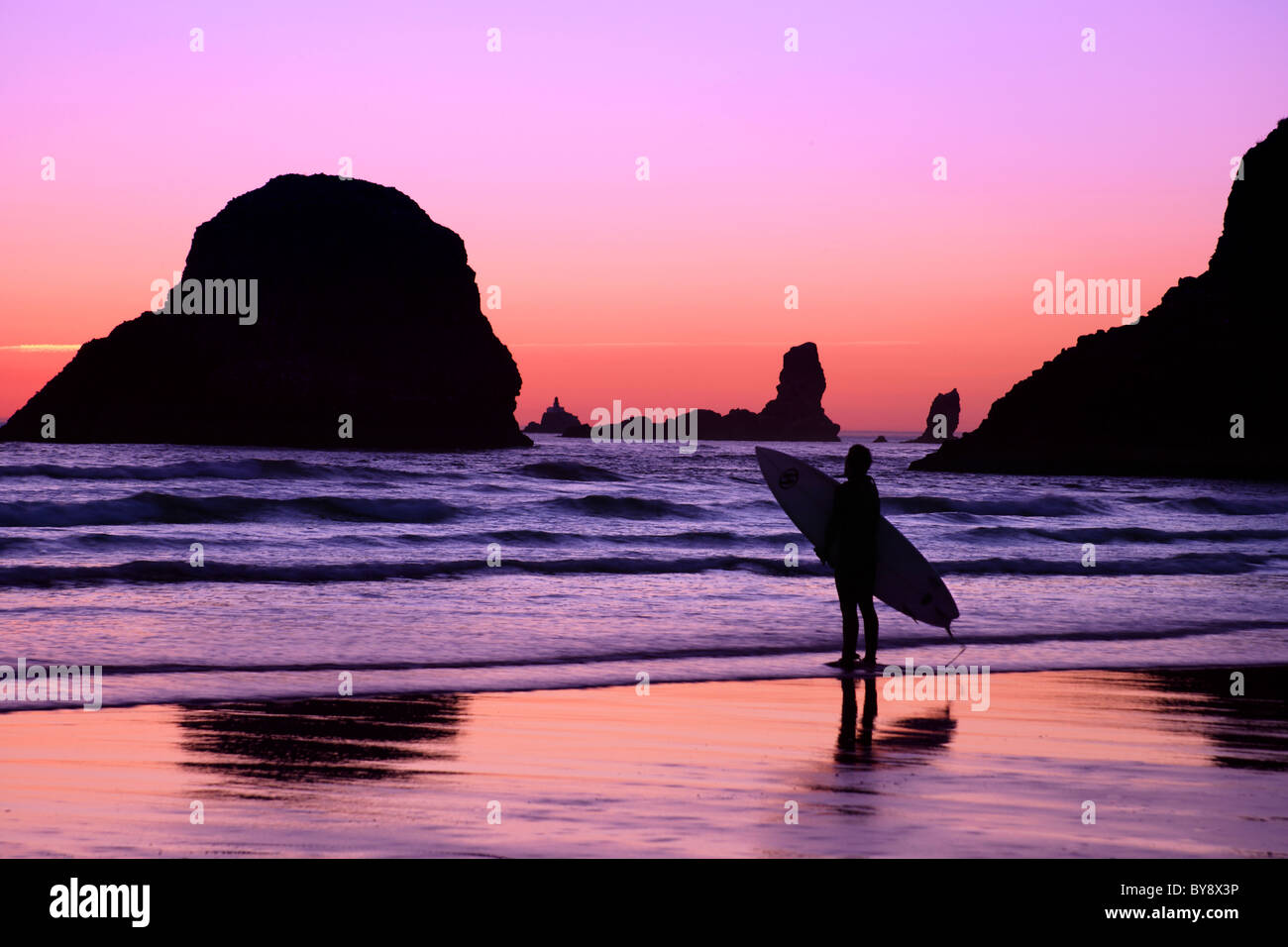 Surfer, Oregon Coast, Cannon Beach at sunset Stock Photo - Alamy