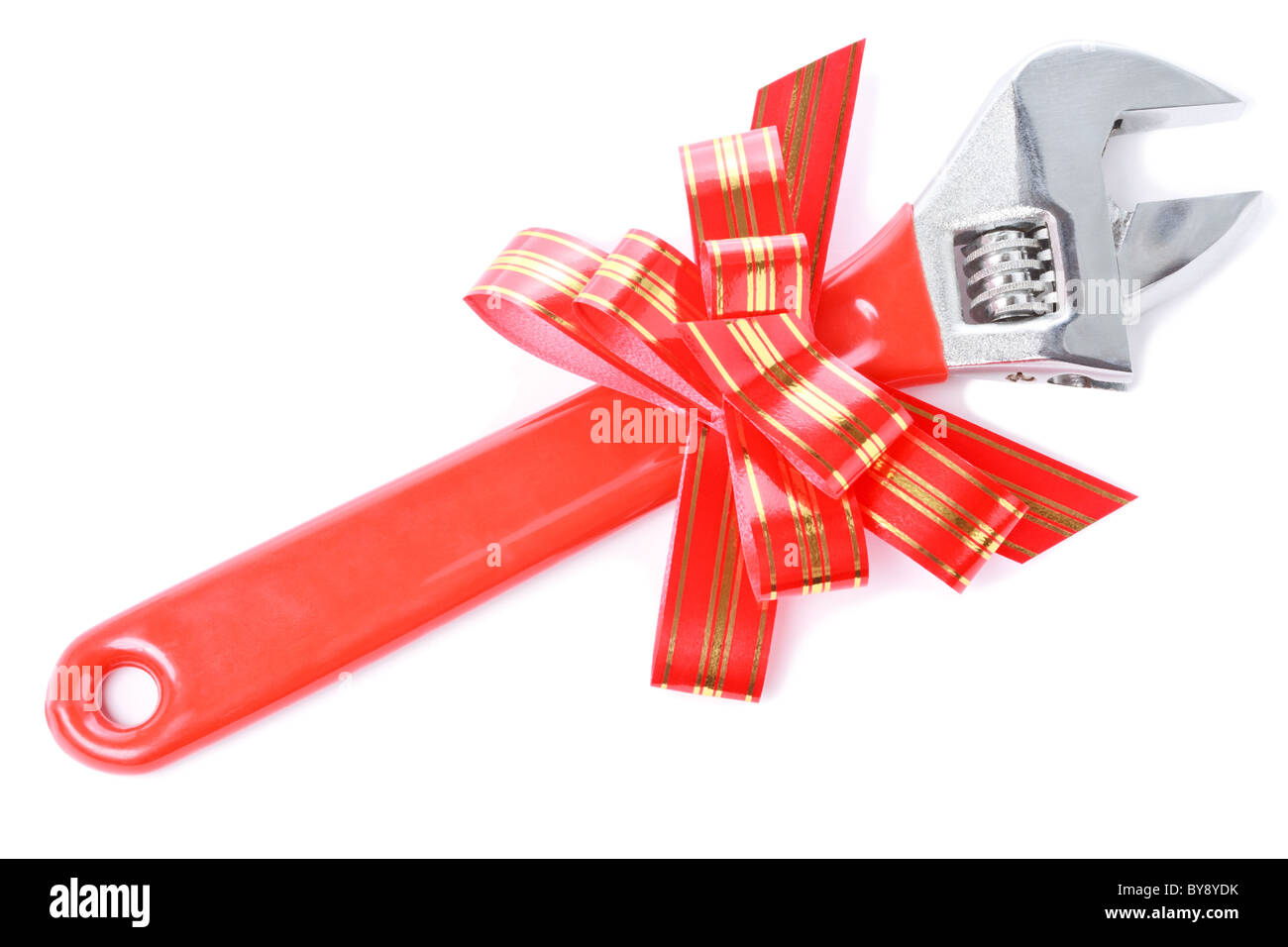 Steel wrench with red plastic handle and red goldish striped bow as a gift for handyman isolated on white background Stock Photo