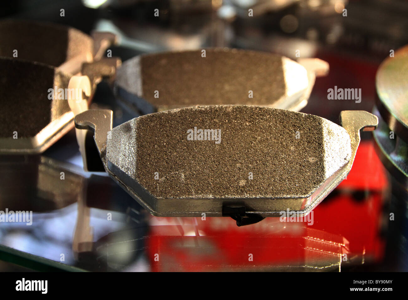 Close image of new high performance brake shoes on display in an exhibition. Stock Photo