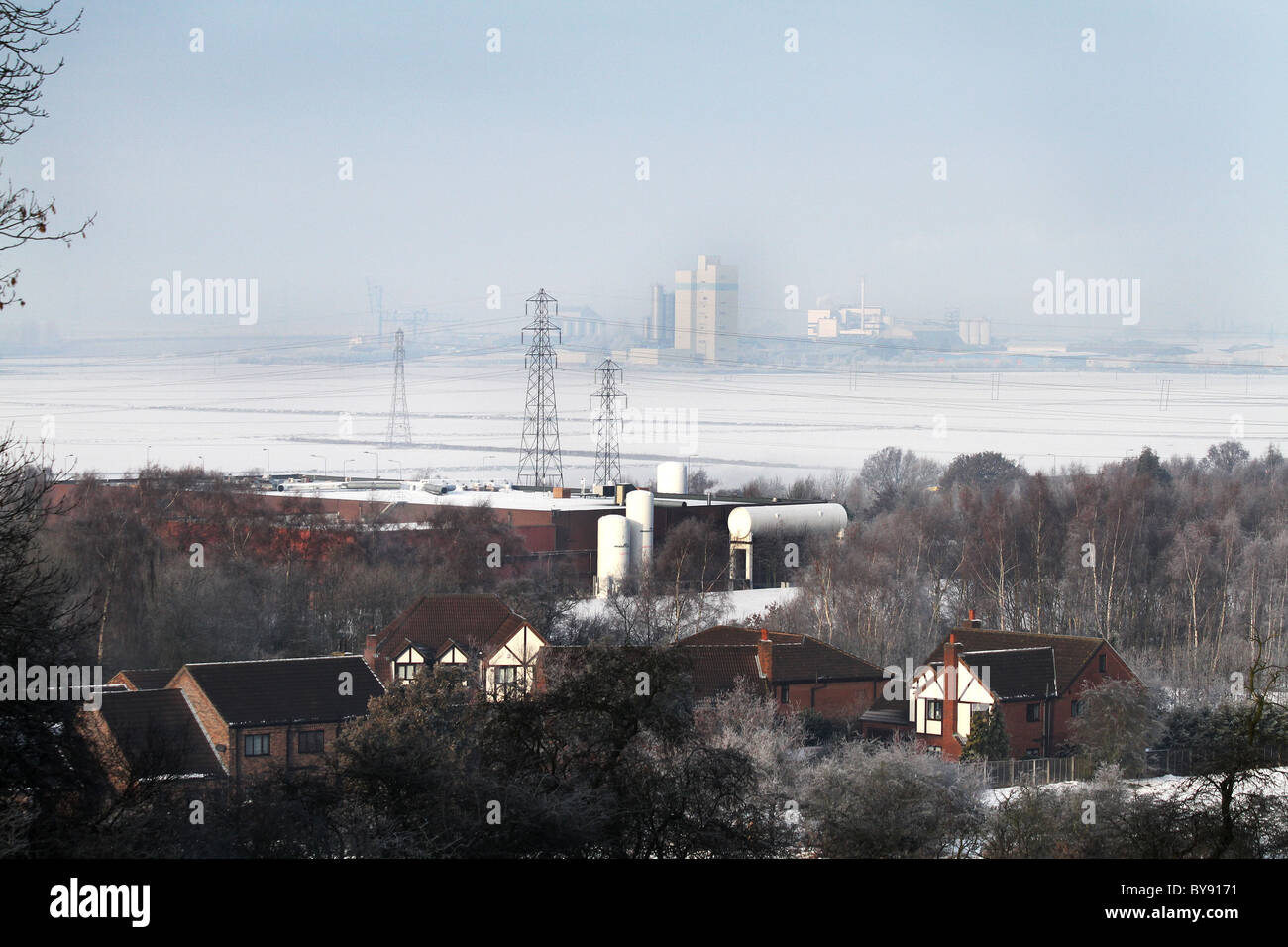 Snow and frost in country and industrial setting. Stock Photo