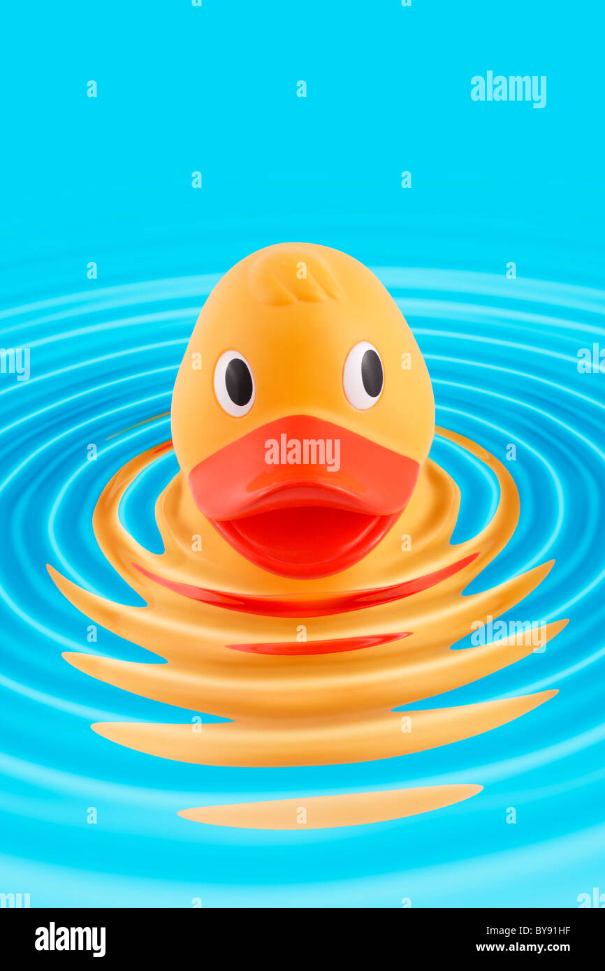 Rubber duck struggling to swim Stock Photo