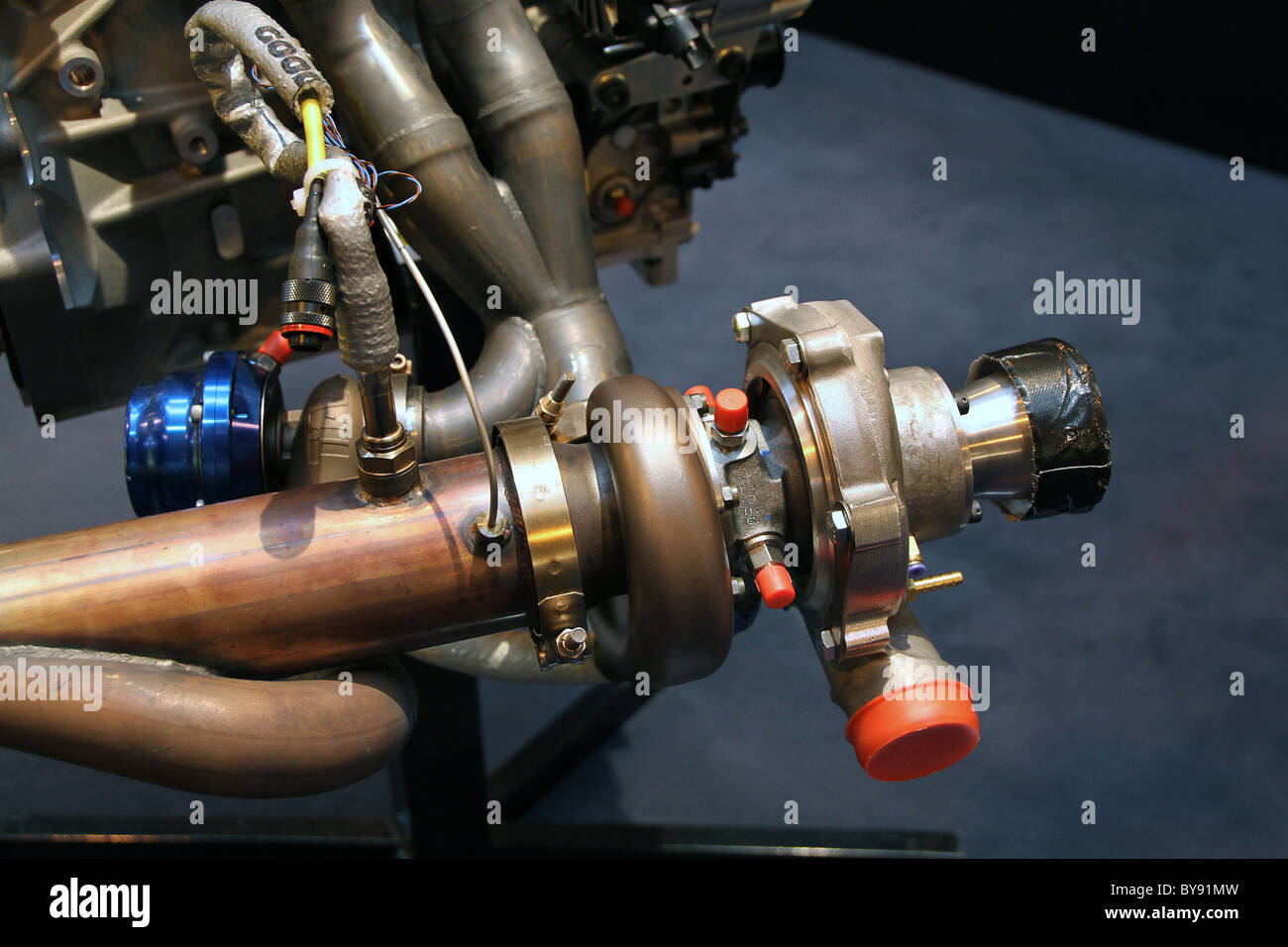 Modern high performance racing engine turbo unit on exhaust system