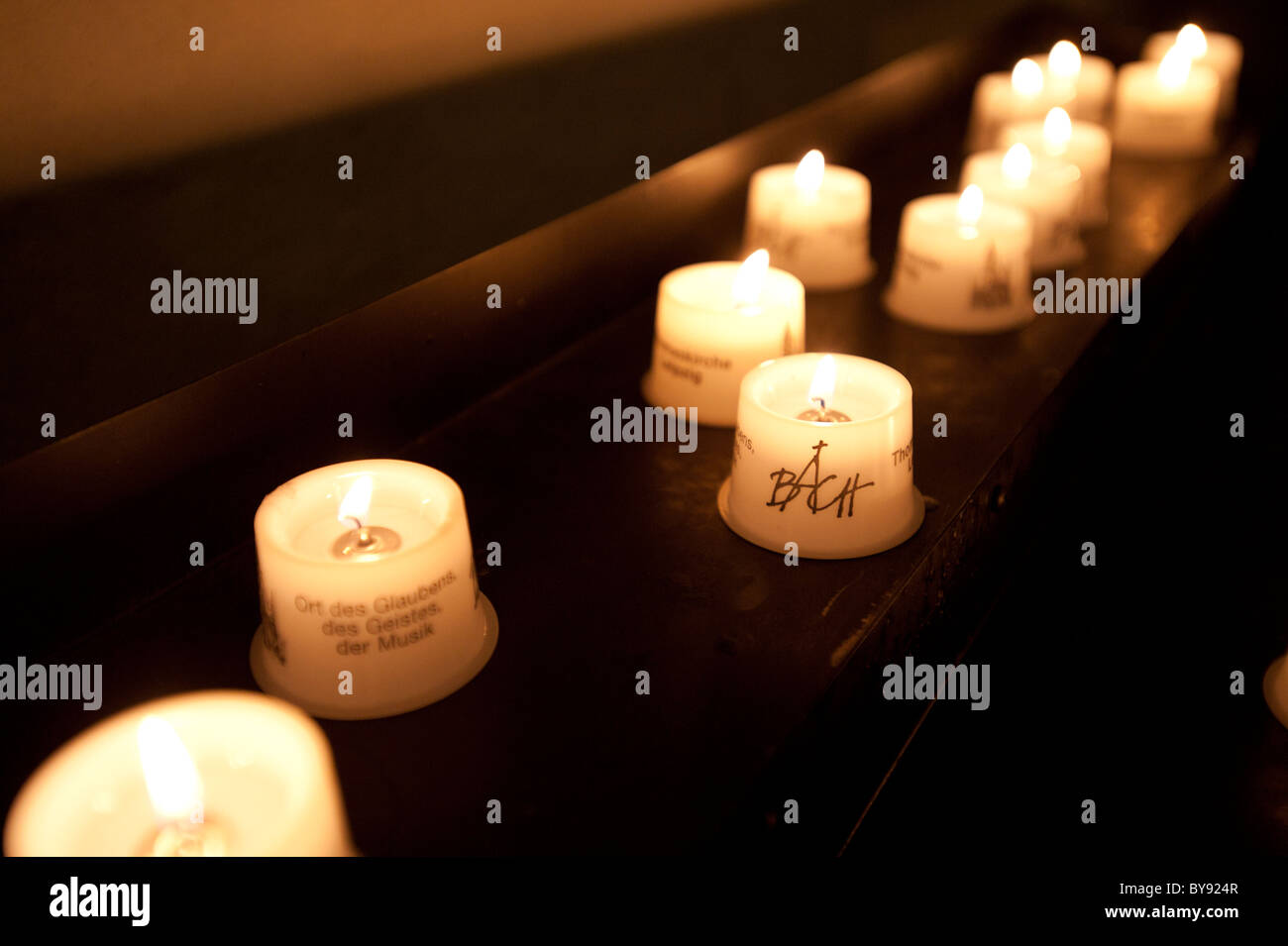 Candles burning in Thomaskirche, Leipzig, Saxony, Germany, Europe Stock Photo