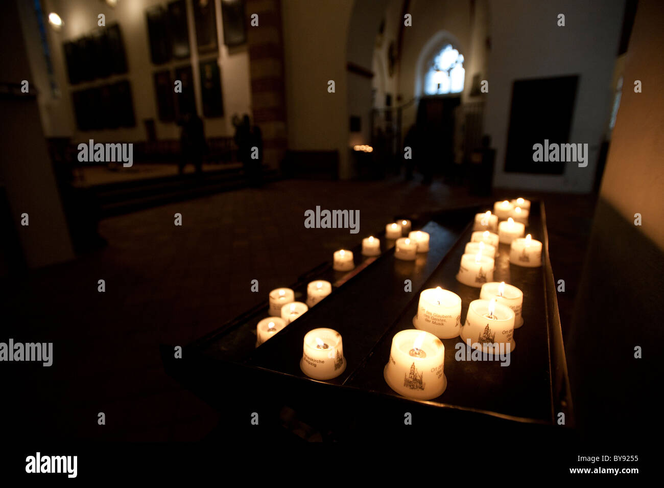Candles burning in Thomaskirche Leipzig, Saxony, Germany, Europe Stock Photo