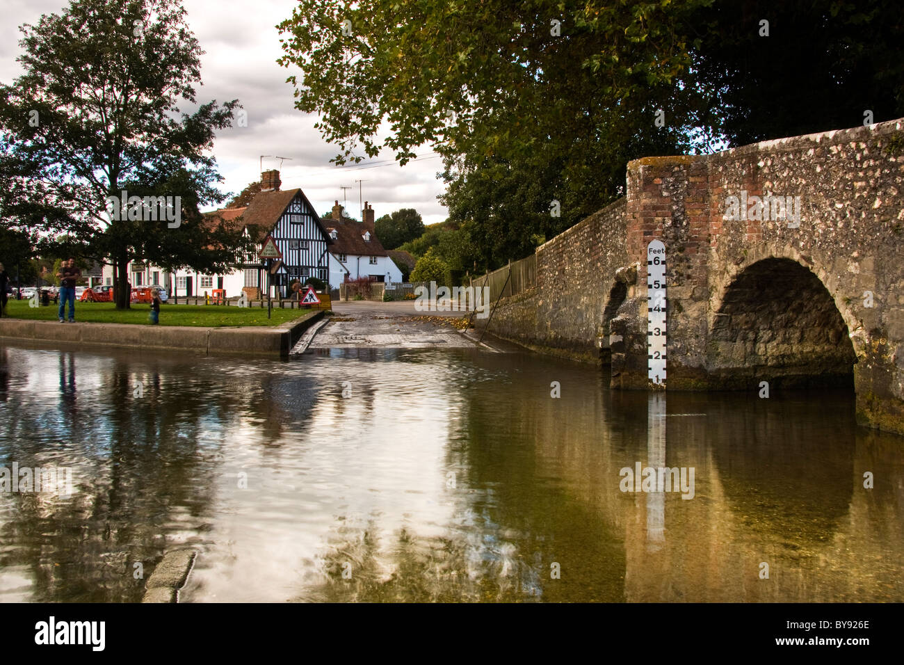The ford at Eynesford with its old stone bridge reflecting in the water