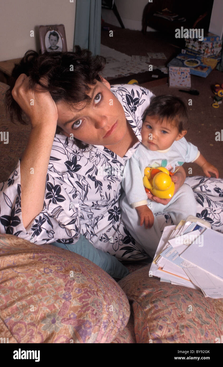 stressed mother holding her baby Stock Photo