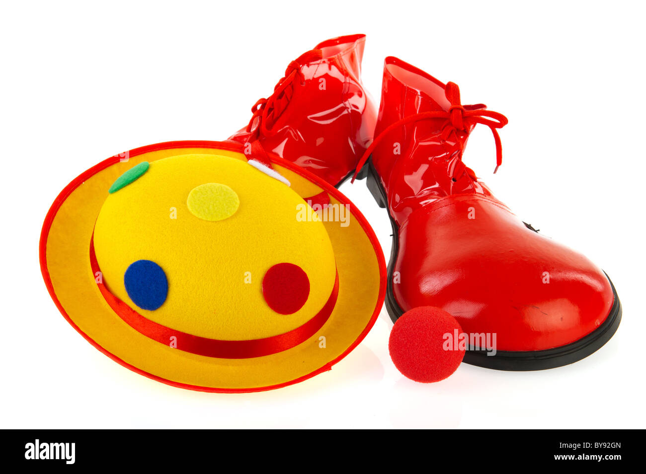 Clowns equipment with hat shoes and red nose Stock Photo