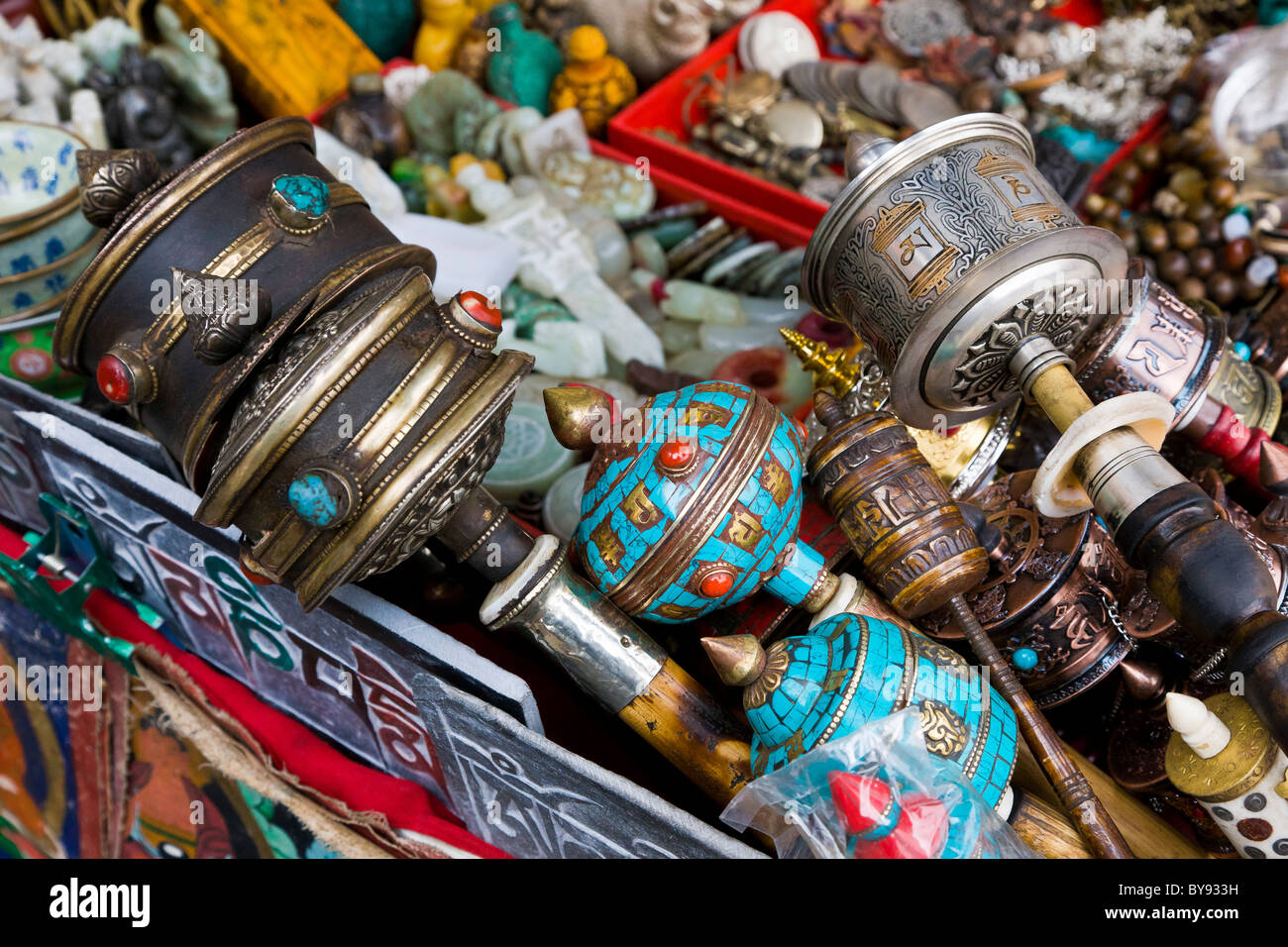 Tibetan prayer wheels for sale on market stall in the Barkhor, Lhasa, Tibet. JMH4509 Stock Photo