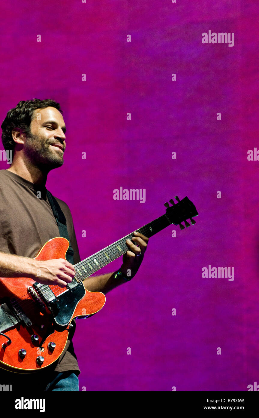 Jack Johnson smiling during a live performance at Mile High Music