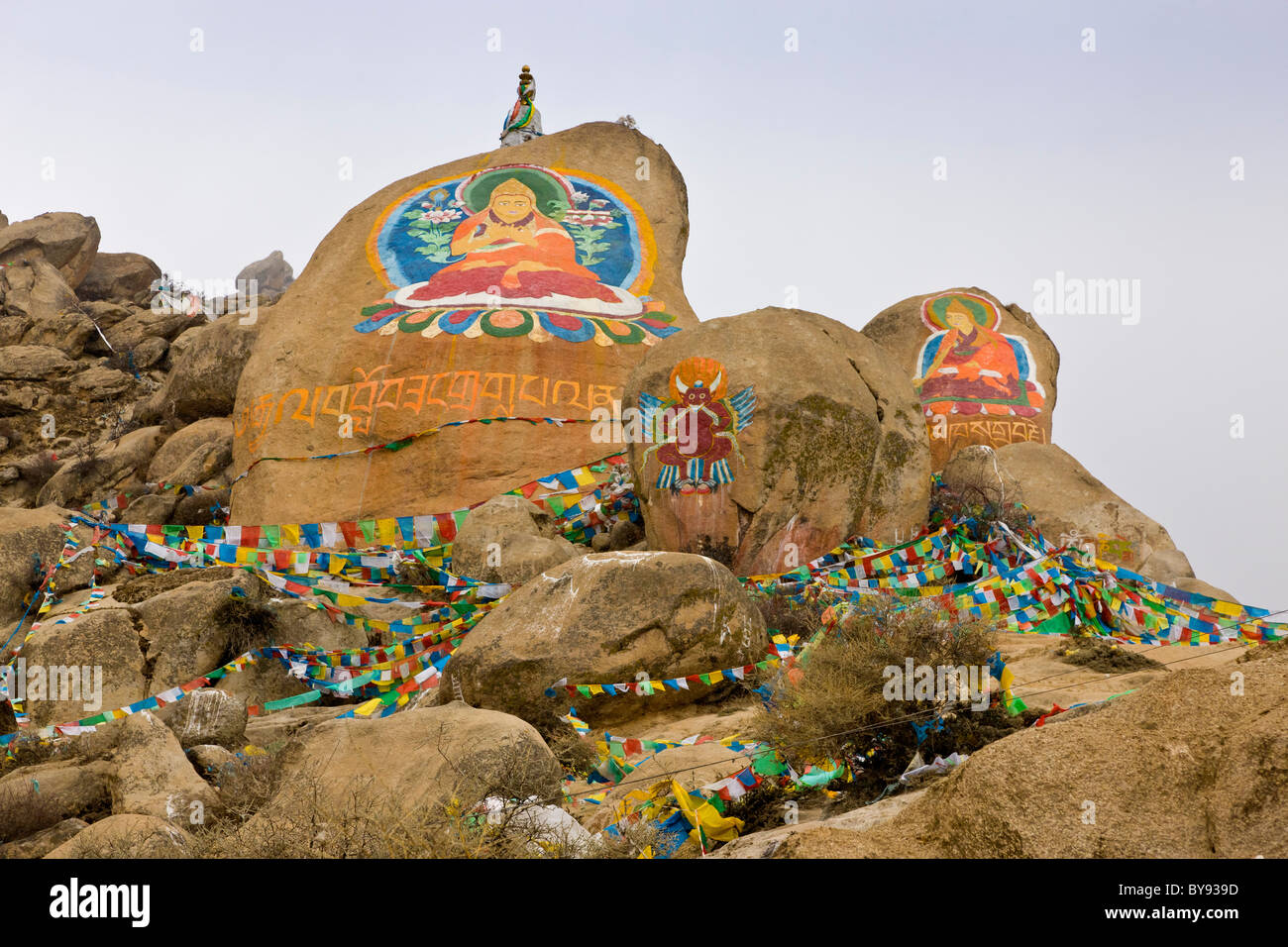 Rock paintings of Buddha at Drepung Monastery, Lhasa, Tibet. JMH4517 Stock Photo