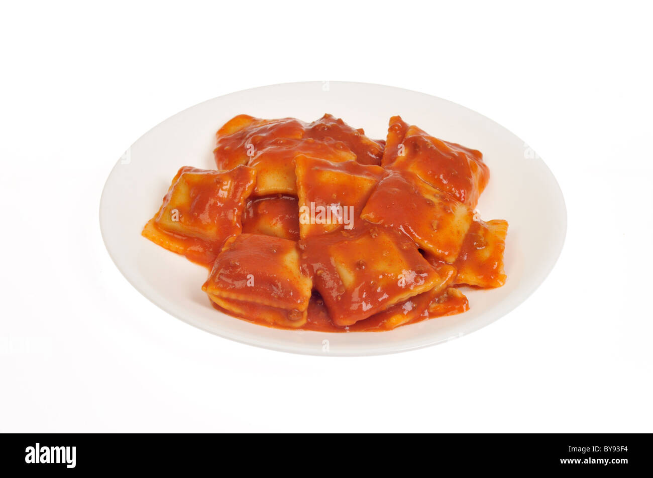Plate of Beef Ravioli in a white bowl on white background, cut out. Stock Photo