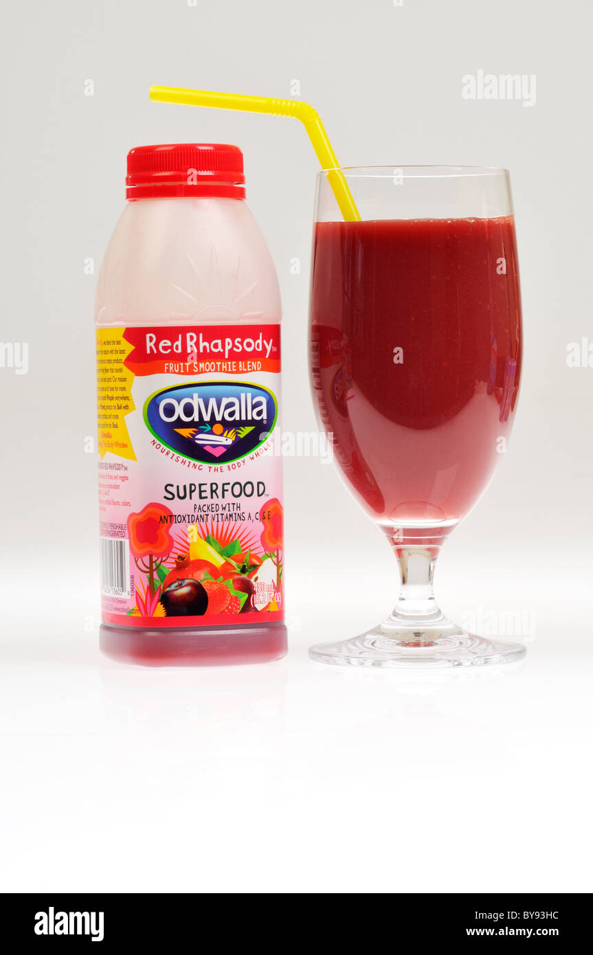Odwalla red rhapsody fruit smoothie blend drink with glass & straw on white background, cutout. Stock Photo