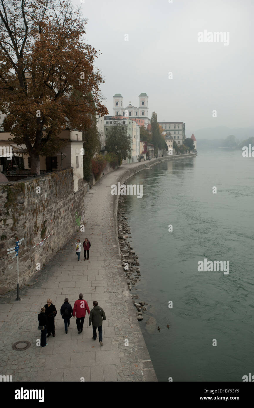 People walking on the promenade along the River Inn in Passau, Bavaria, Germany, Europe Stock Photo