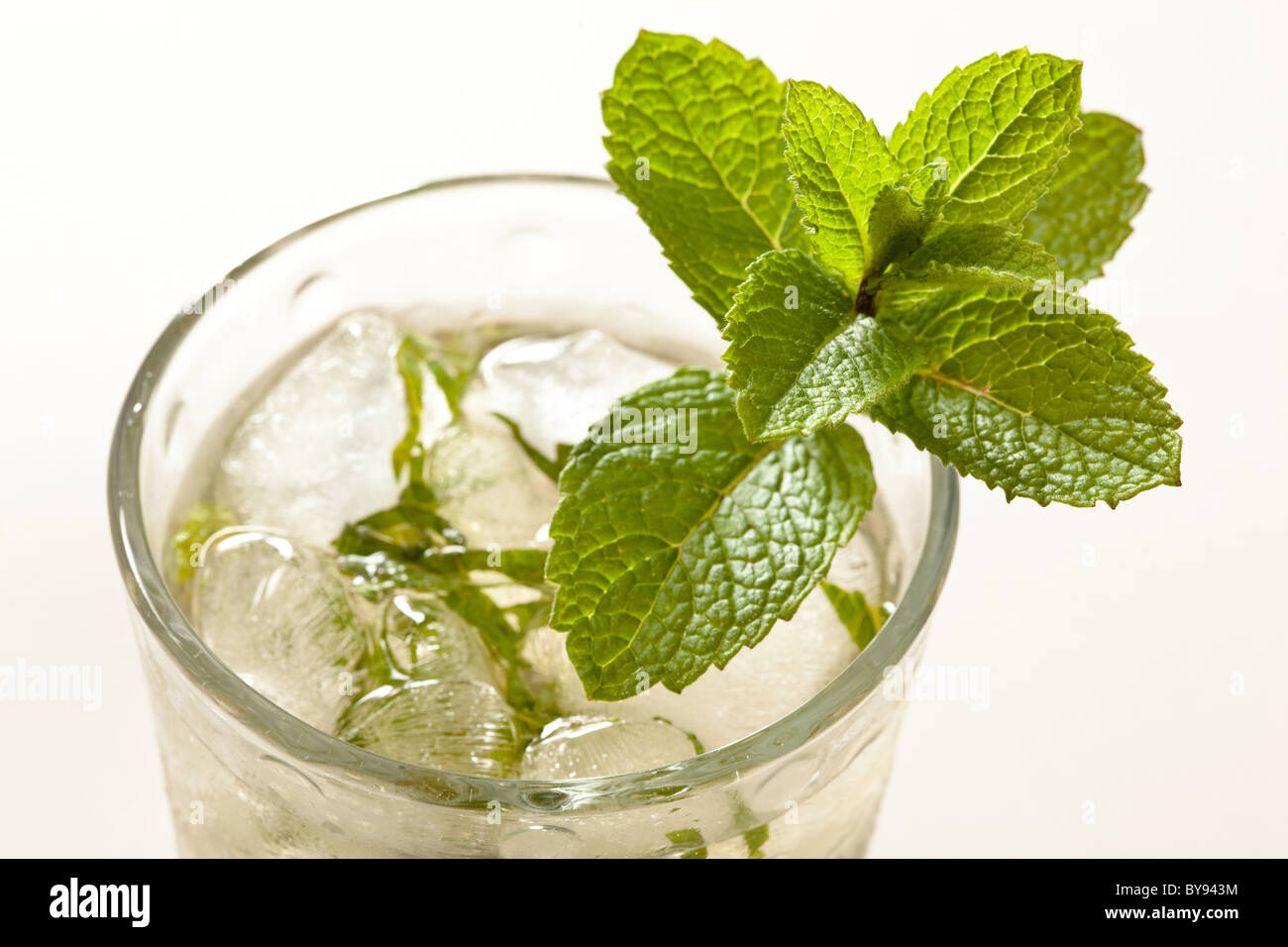 A Mojito is usually made of rum, sugar, lime juice, sparkling water and mint, and poured over