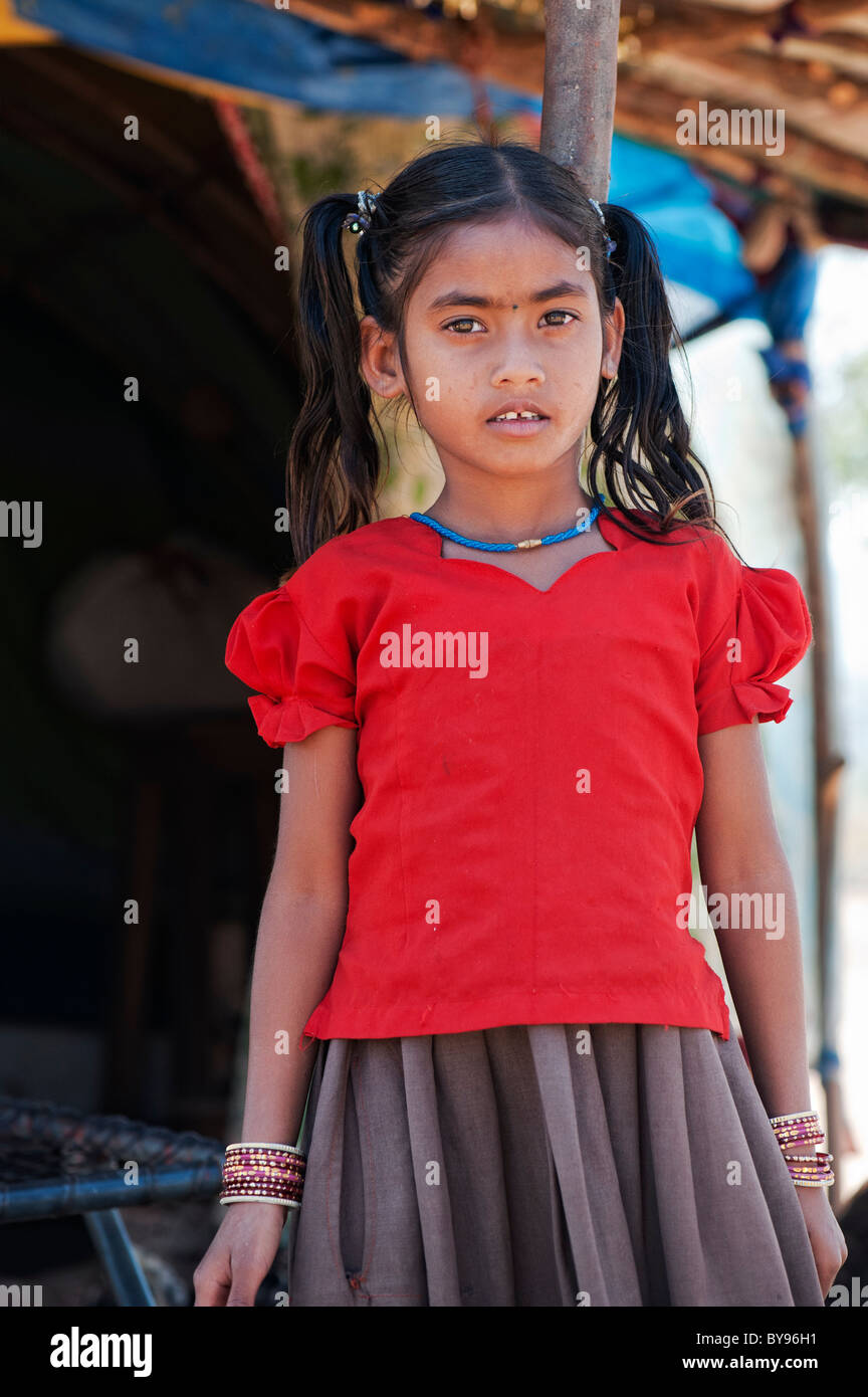 Young poor lower caste Indian girl in front of her home. Andhra Pradesh, India Stock Photo