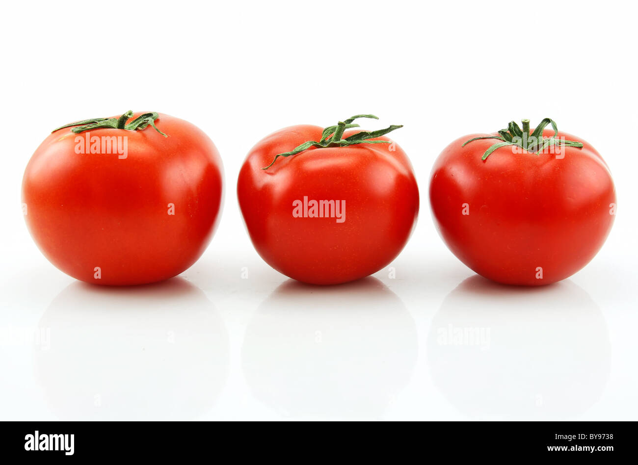 Three Ripe Tomatoes Isolated on White Stock Photo - Alamy