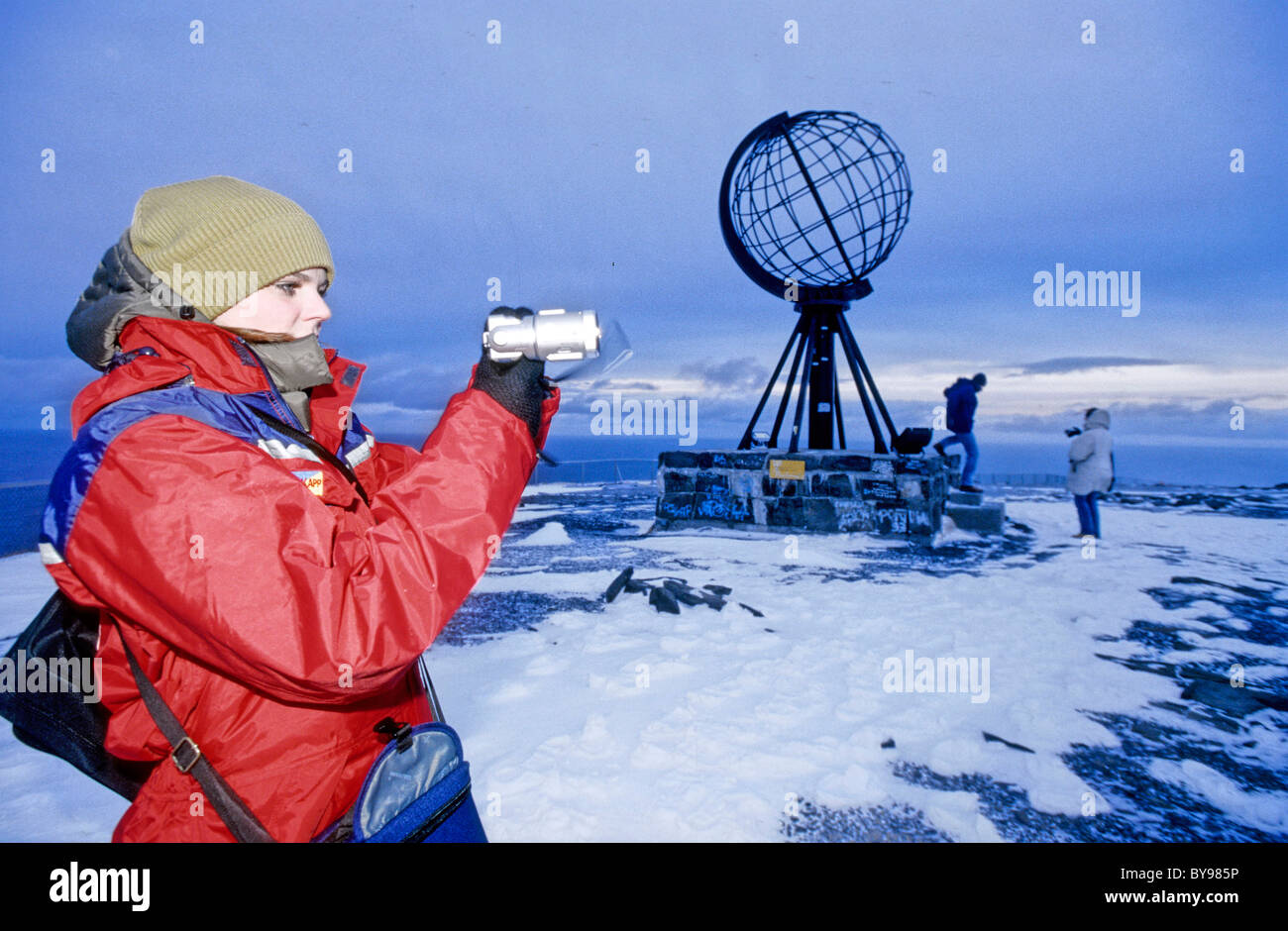 North Cape, Norway in winter, Globe statue at the cape. Tourists. Stock Photo