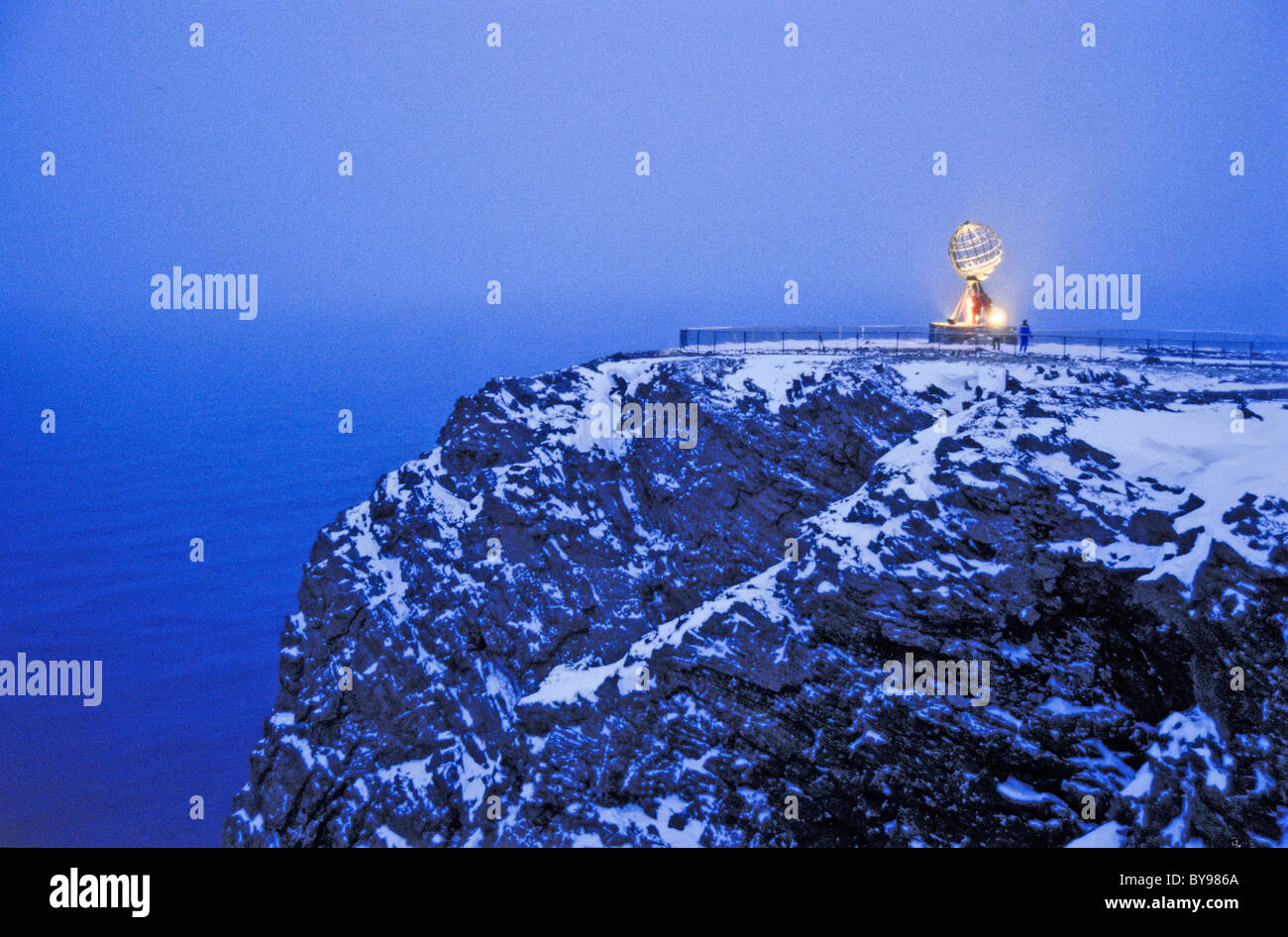 North Cape, Norway in winter, Globe statue at the cape. Tourists Stock