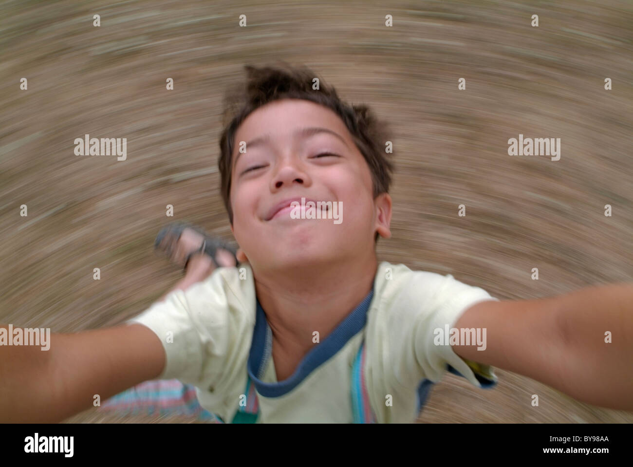 France Young Boy Looking Up At Camera While Spinning Stock Photo - Alamy