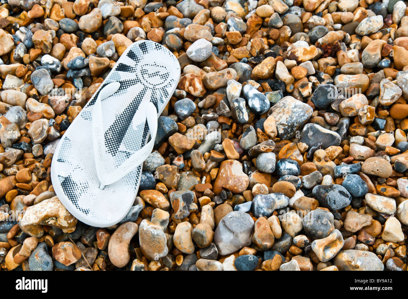 Lost flip flop on the beach Stock Photo