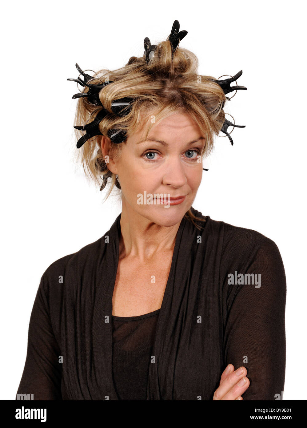 Woman wearing hair curlers Stock Photo