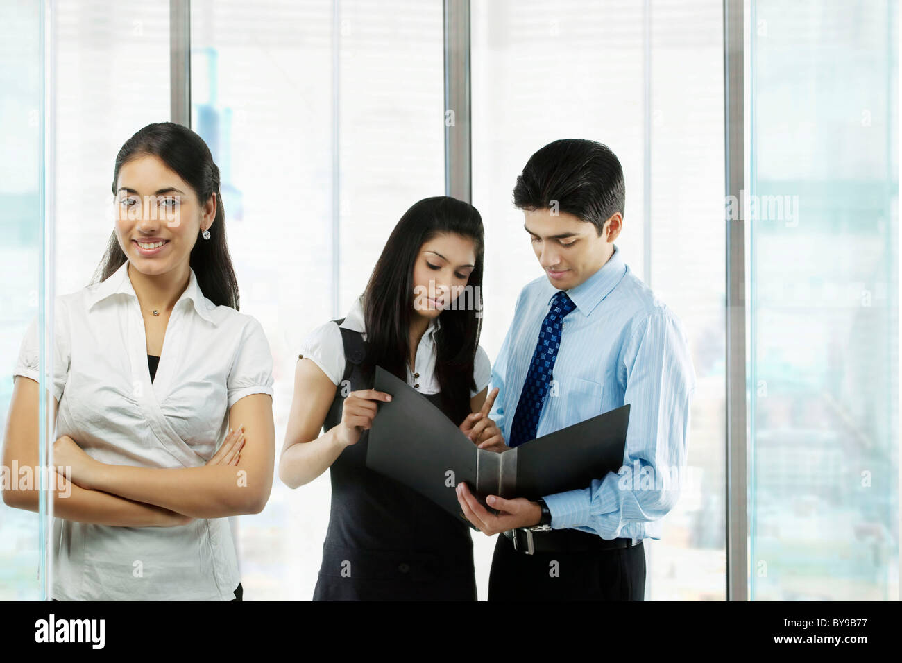 Businesspeople looking at a file Stock Photo