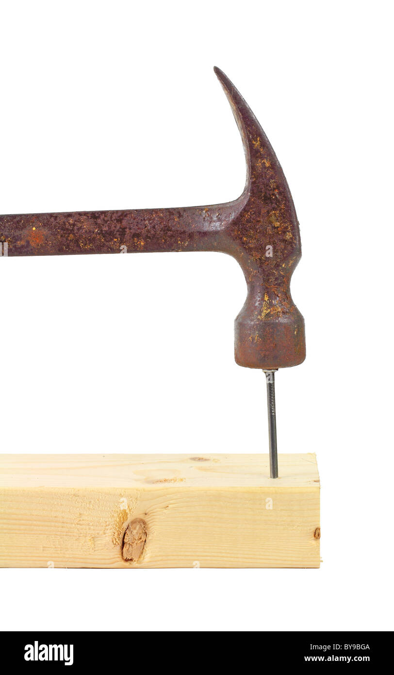 Hammering nail into wood stud Stock Photo