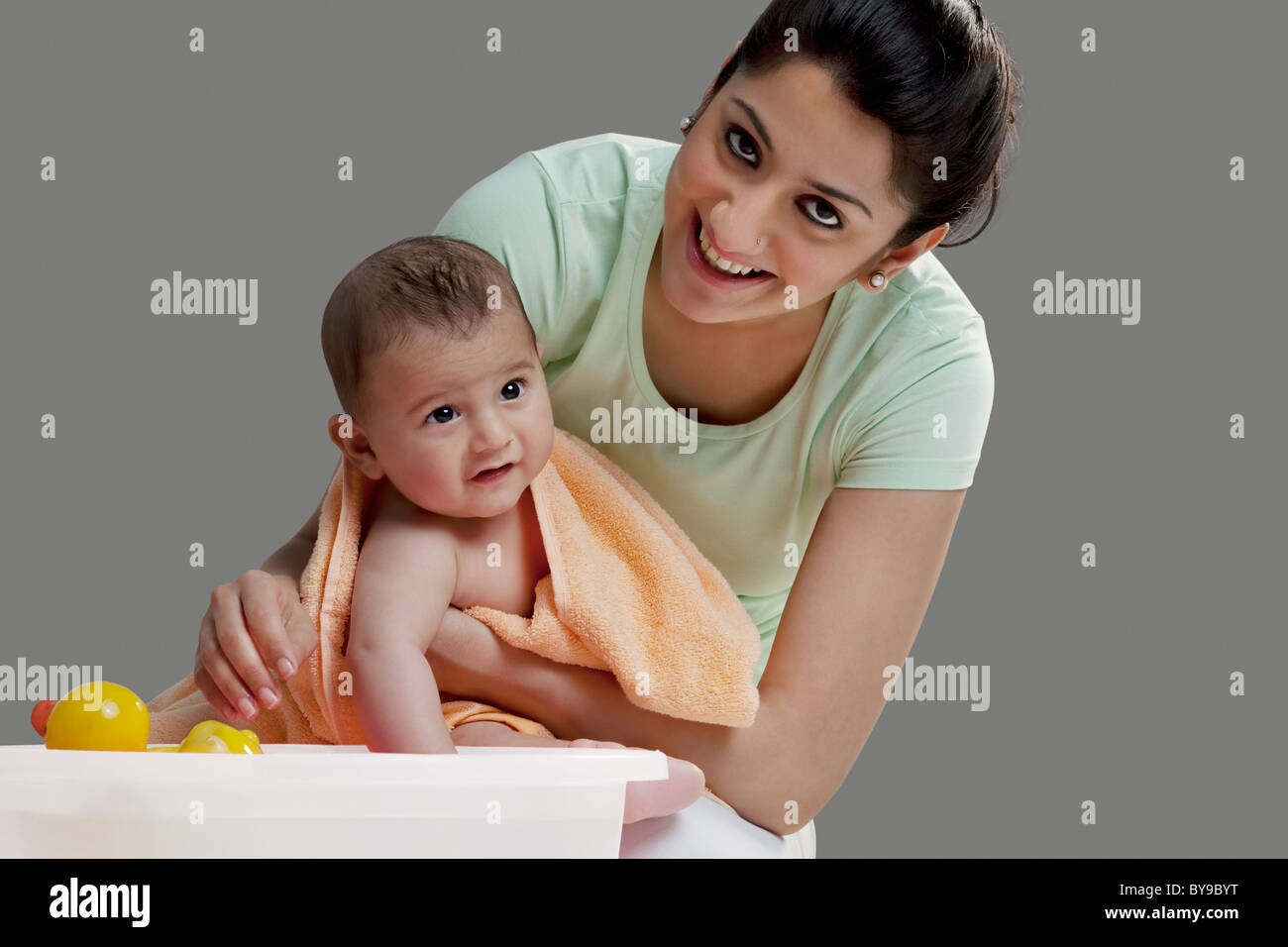 Mother wiping her baby after a bath Stock Photo Alamy