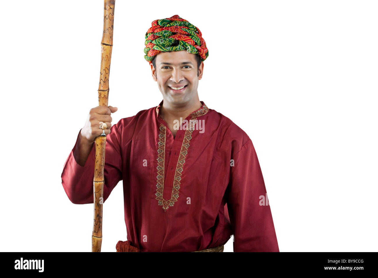 Gujarati man holding a stick Stock Photo