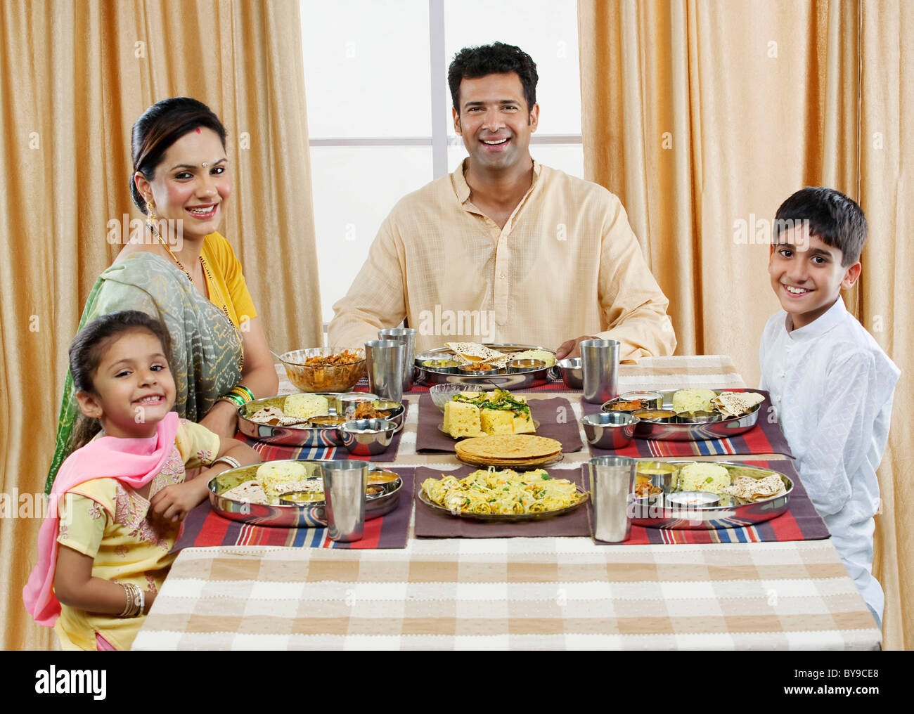 Indian family having lunch together hi-res stock photography and images ...