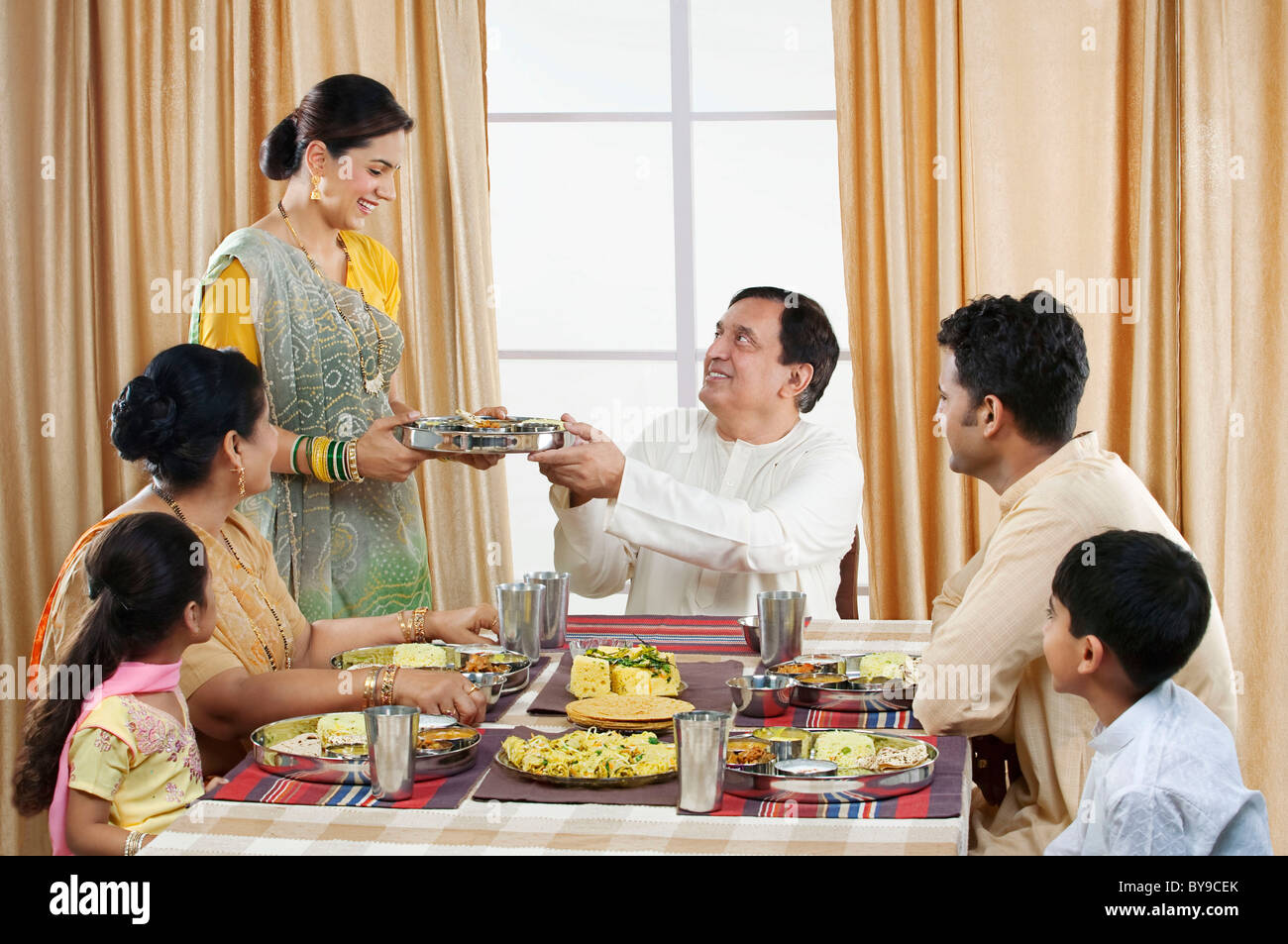 Indian family having lunch together hi-res stock photography and images ...