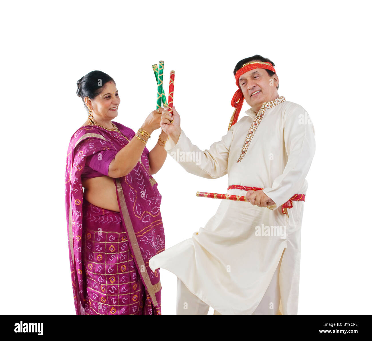 Couple performing dandiya dance Stock Photo - Alamy