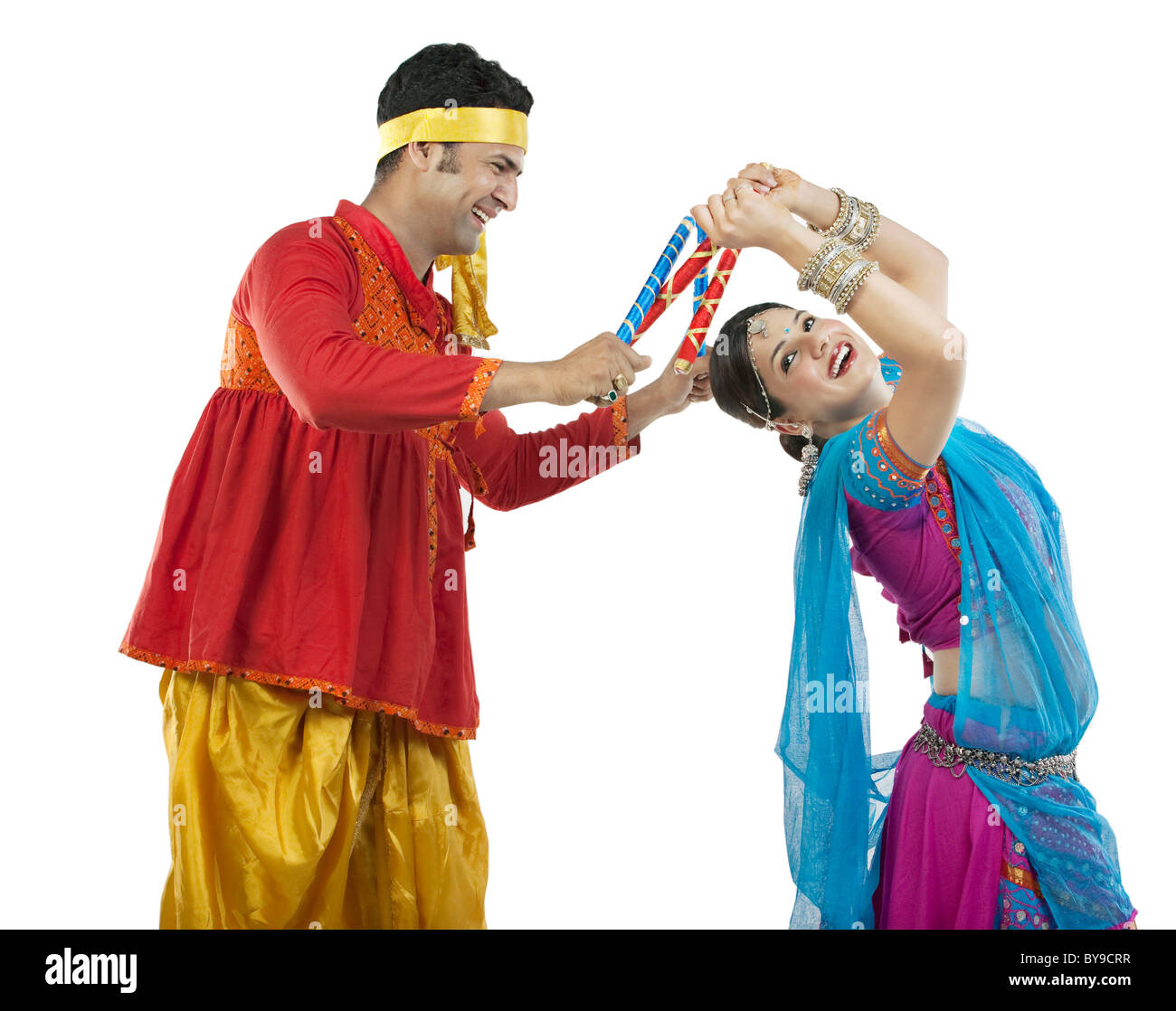 Gujarati couple performing dandiya dance Stock Photo - Alamy