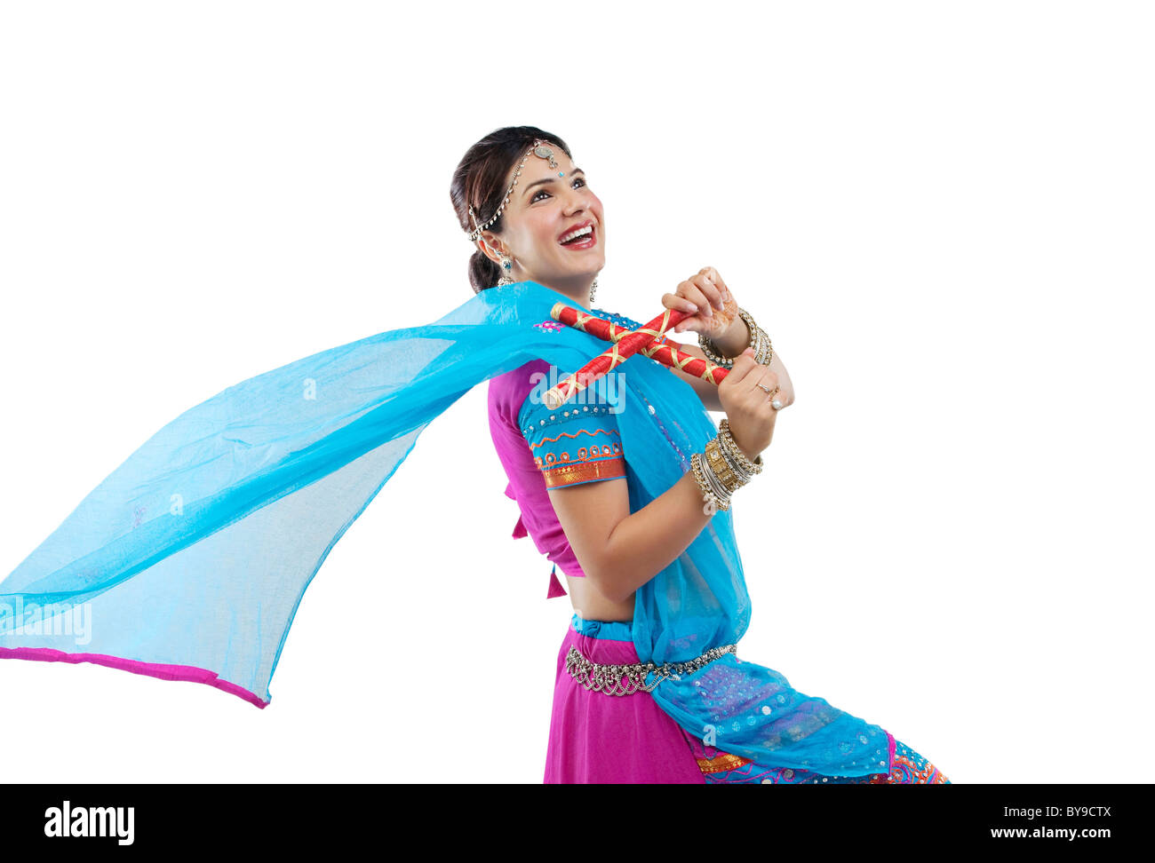 Gujarati woman dancing dandiya sticks hires stock photography and