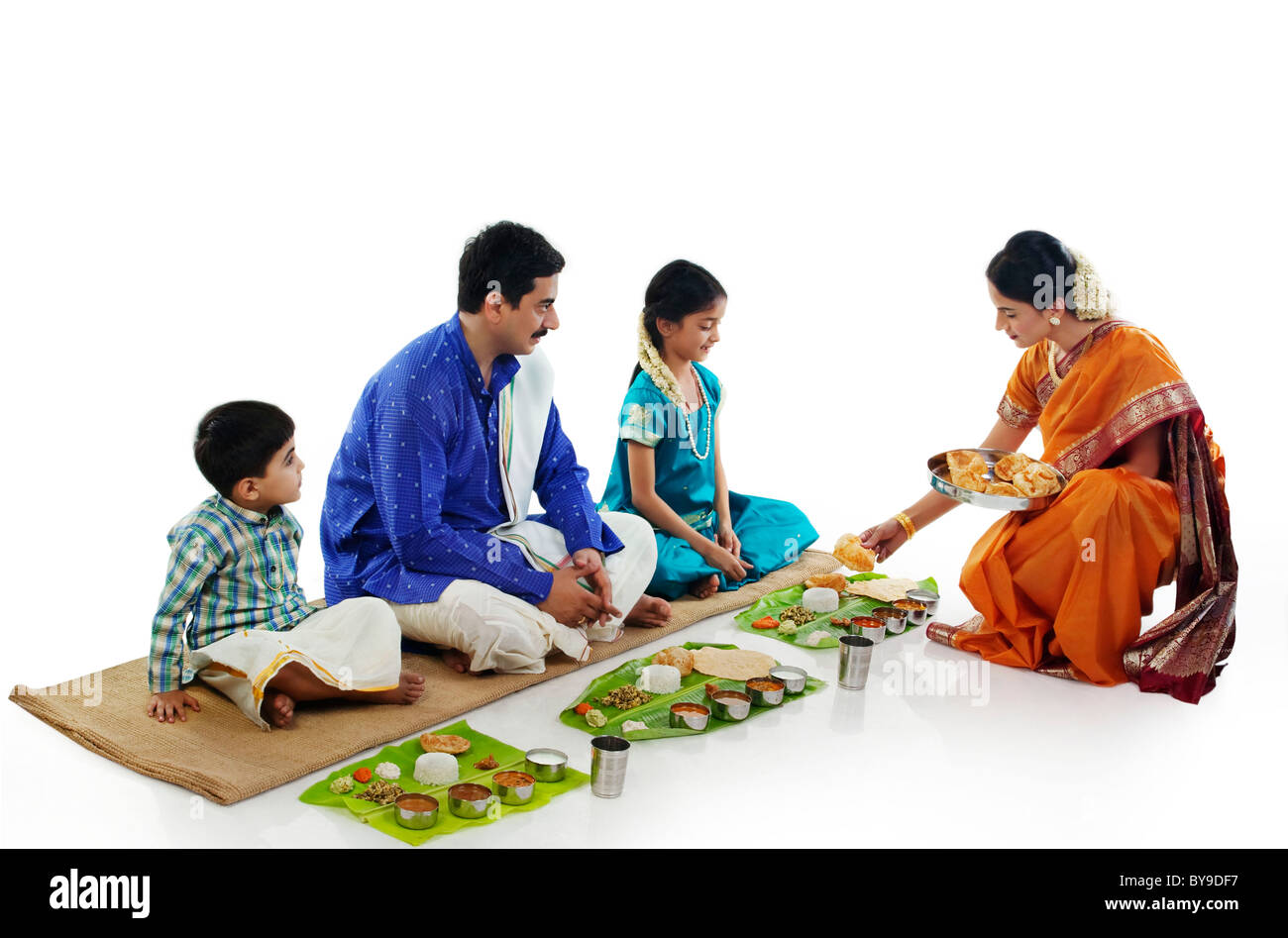 South Indian woman serving food to her family Stock Photo Alamy