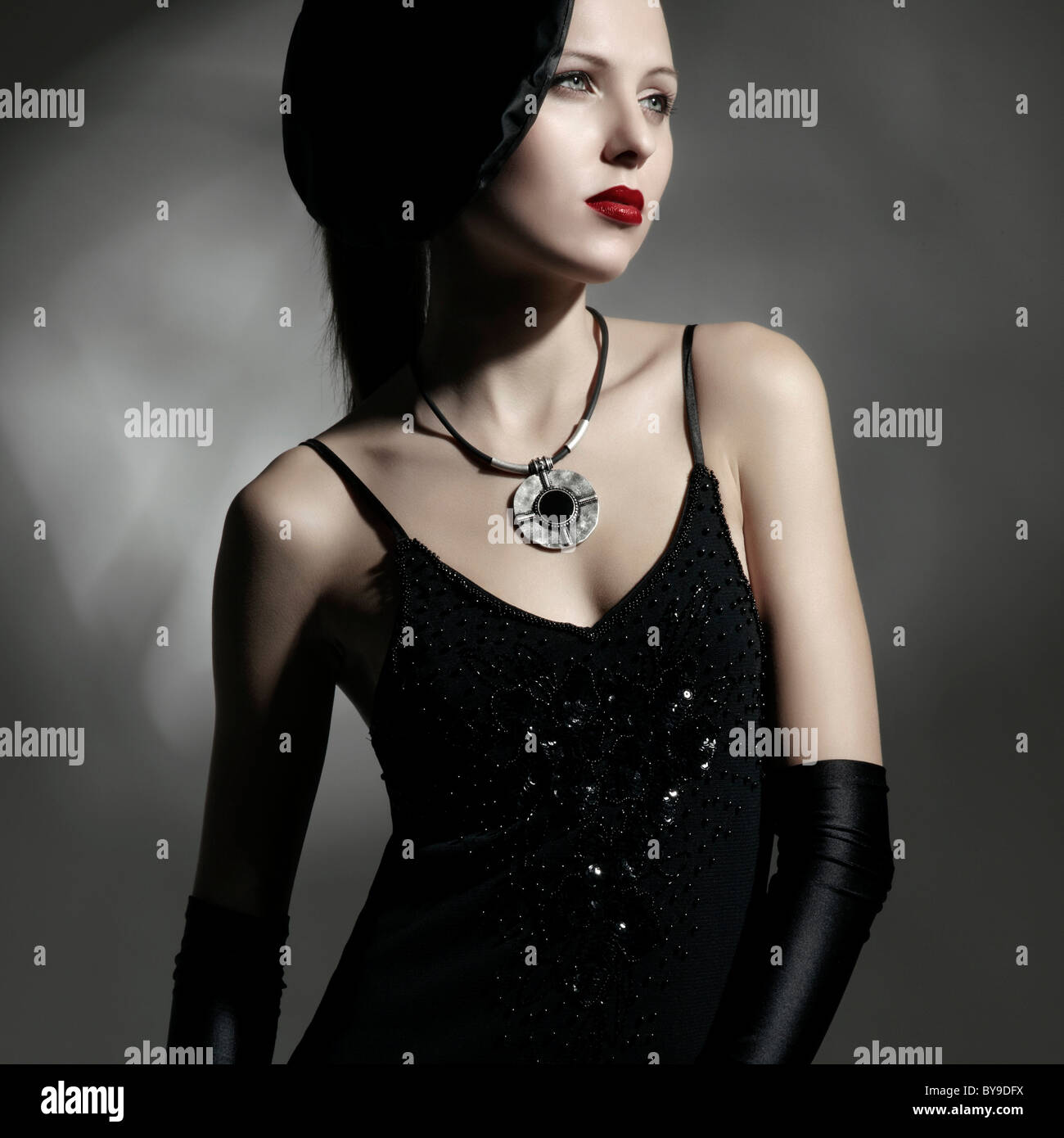 Young woman wearing an elegant black dress and hat, portrait Stock ...
