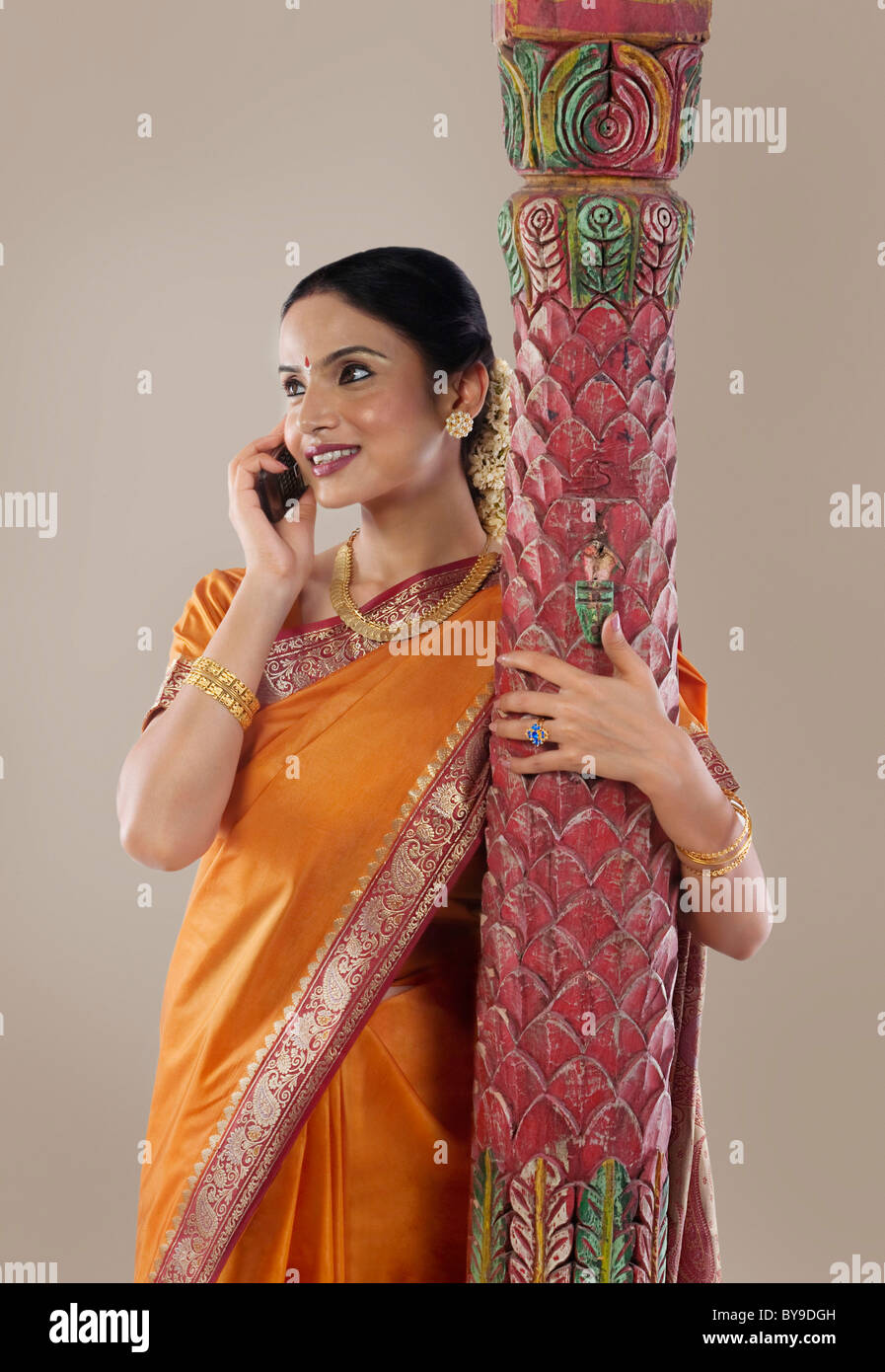 South Indian woman talking on a mobile phone Stock Photo - Alamy