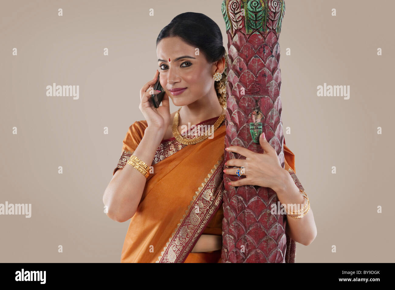 South Indian woman talking on a mobile phone Stock Photo - Alamy