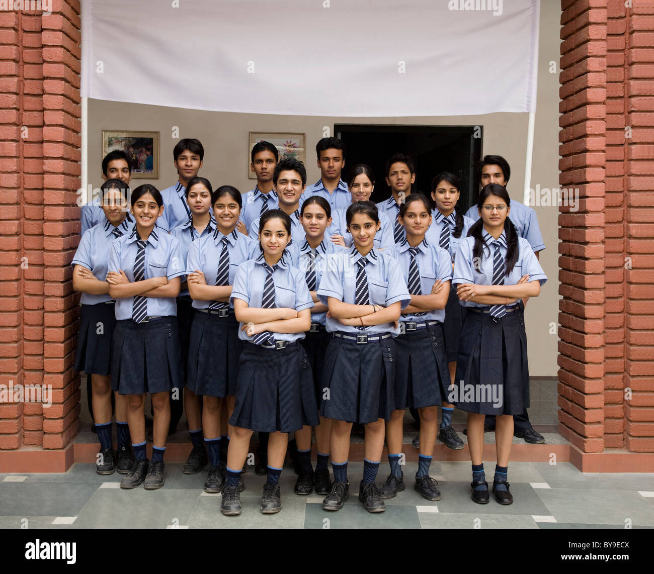 Portrait of students in front of a school Stock Photo