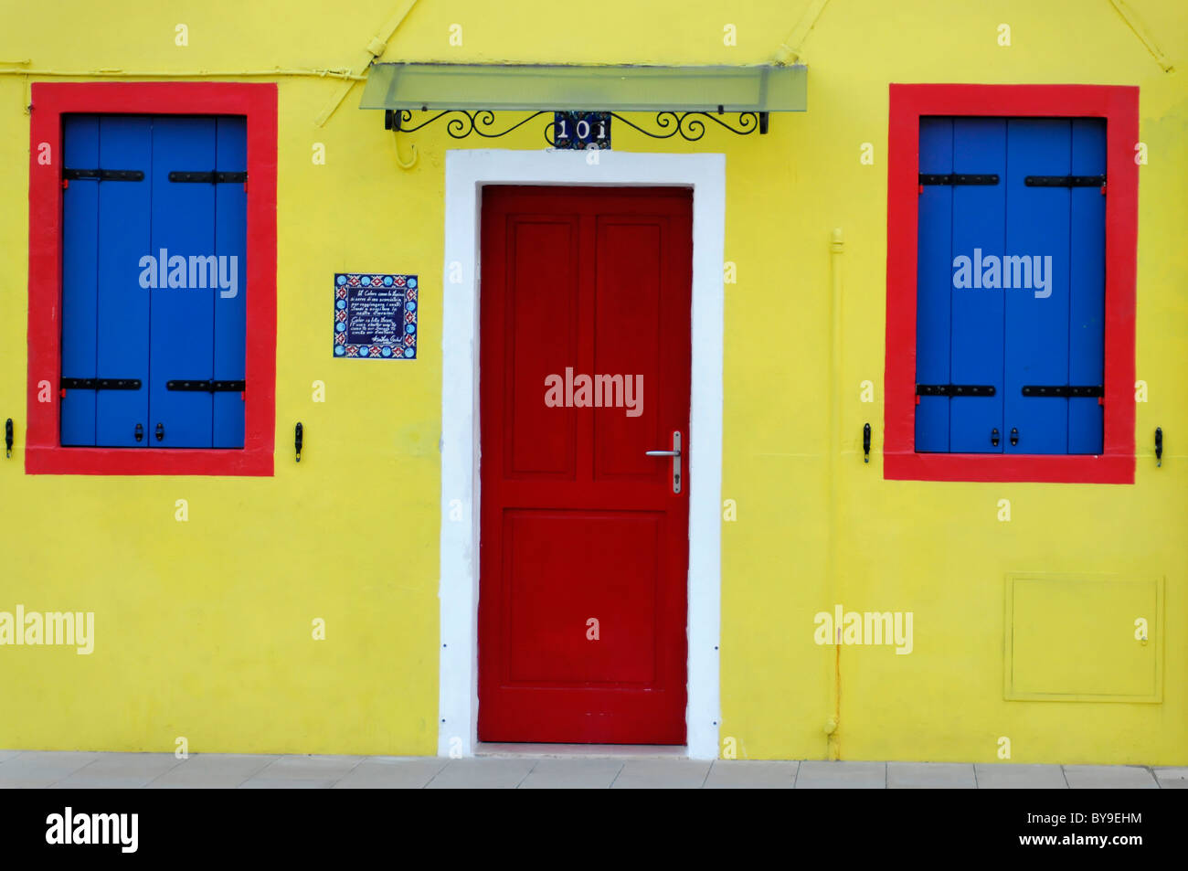 Colourful facade of a house with door and windows, Burano Island ...