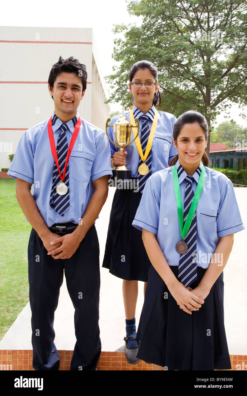 Students with medals and trophy Stock Photo