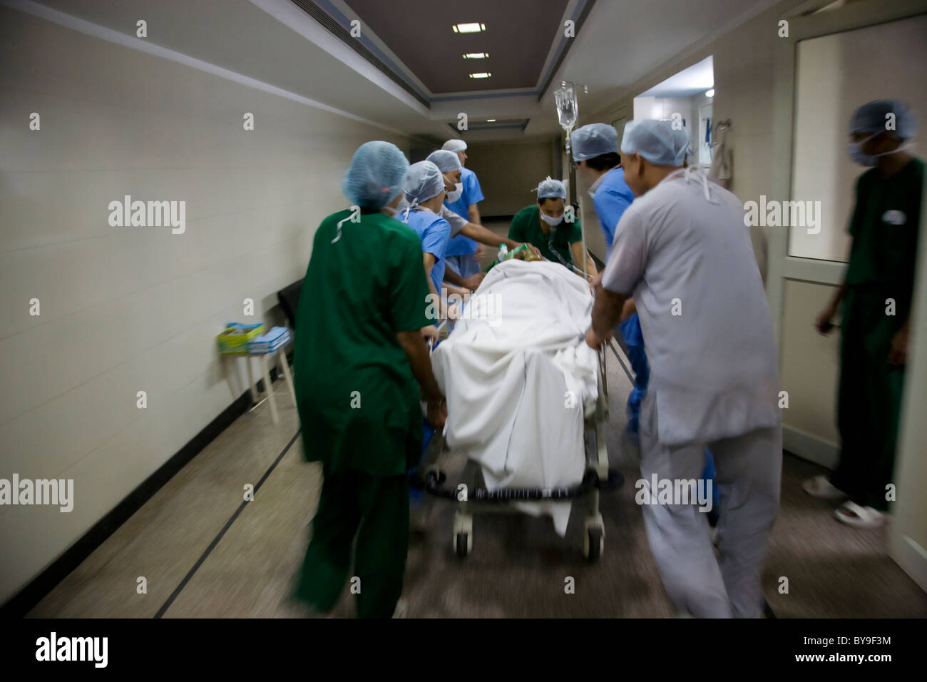 Taking Operation Surgeons taking a patient to an operation theatre Stock Photo - Alamy