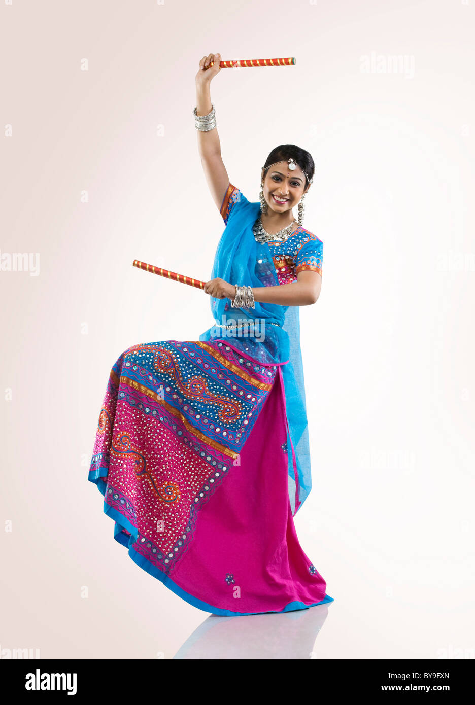 Gujarati woman with dandiya sticks Stock Photo Alamy