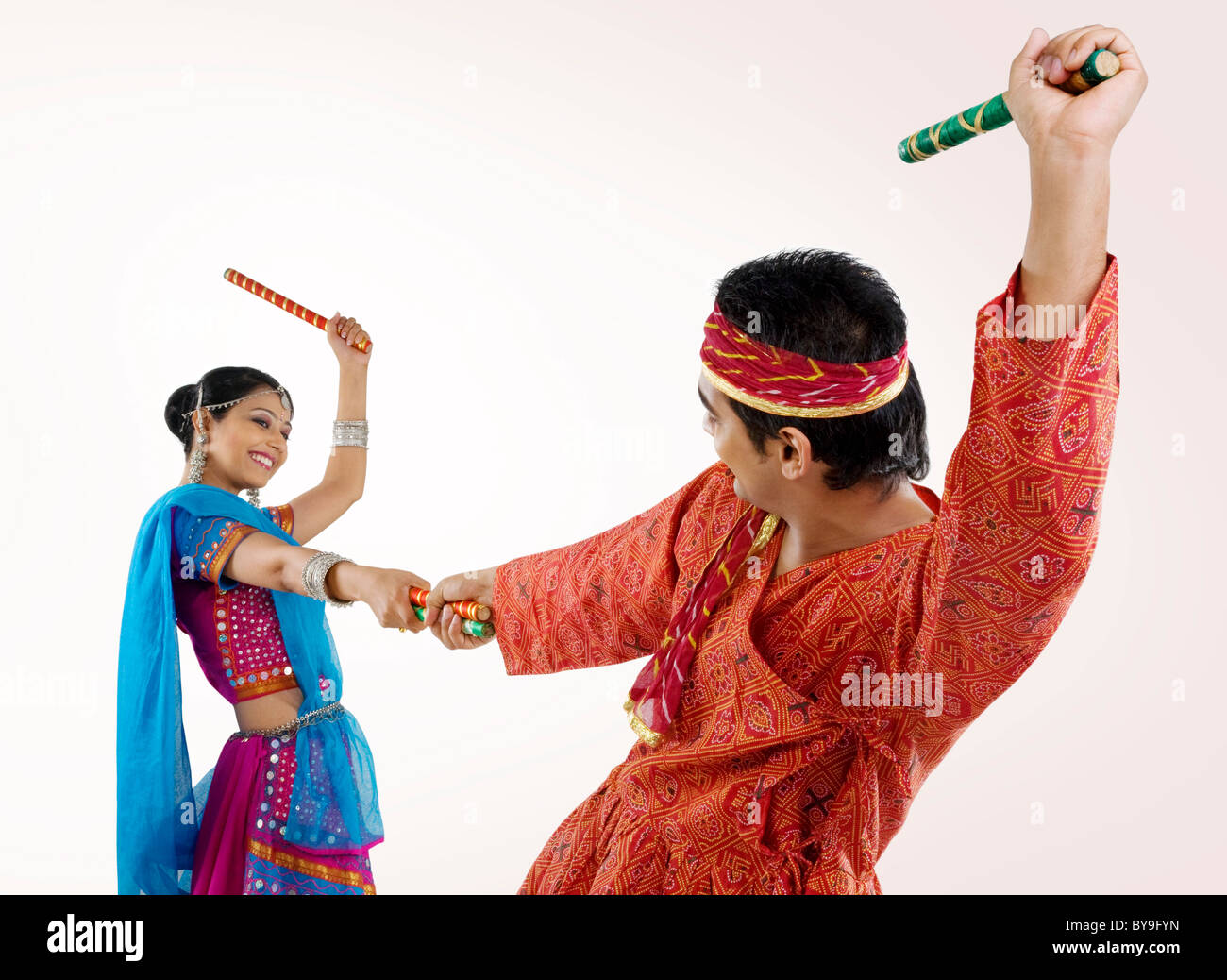 Gujarati couple performing dandiya Stock Photo