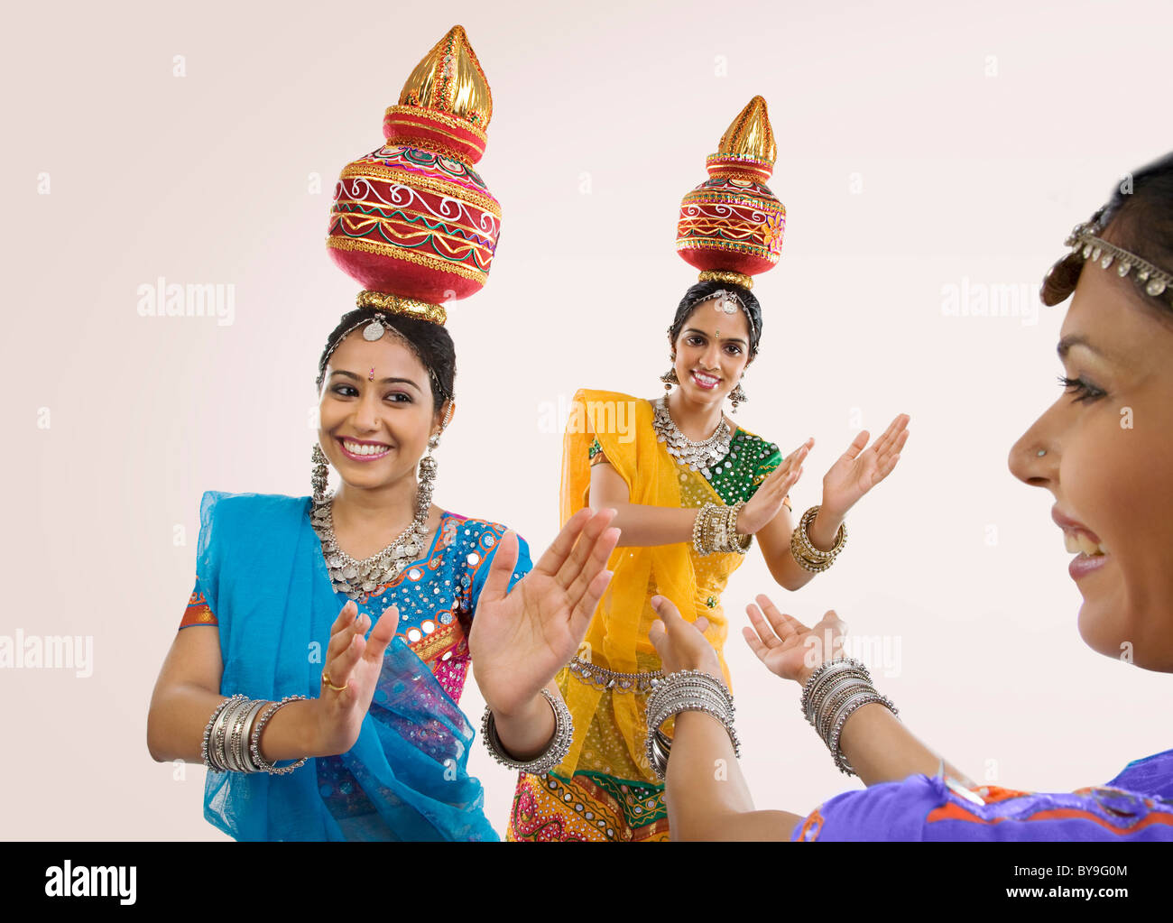 Gujarati women dancing with a kalash on their head Stock Photo Alamy